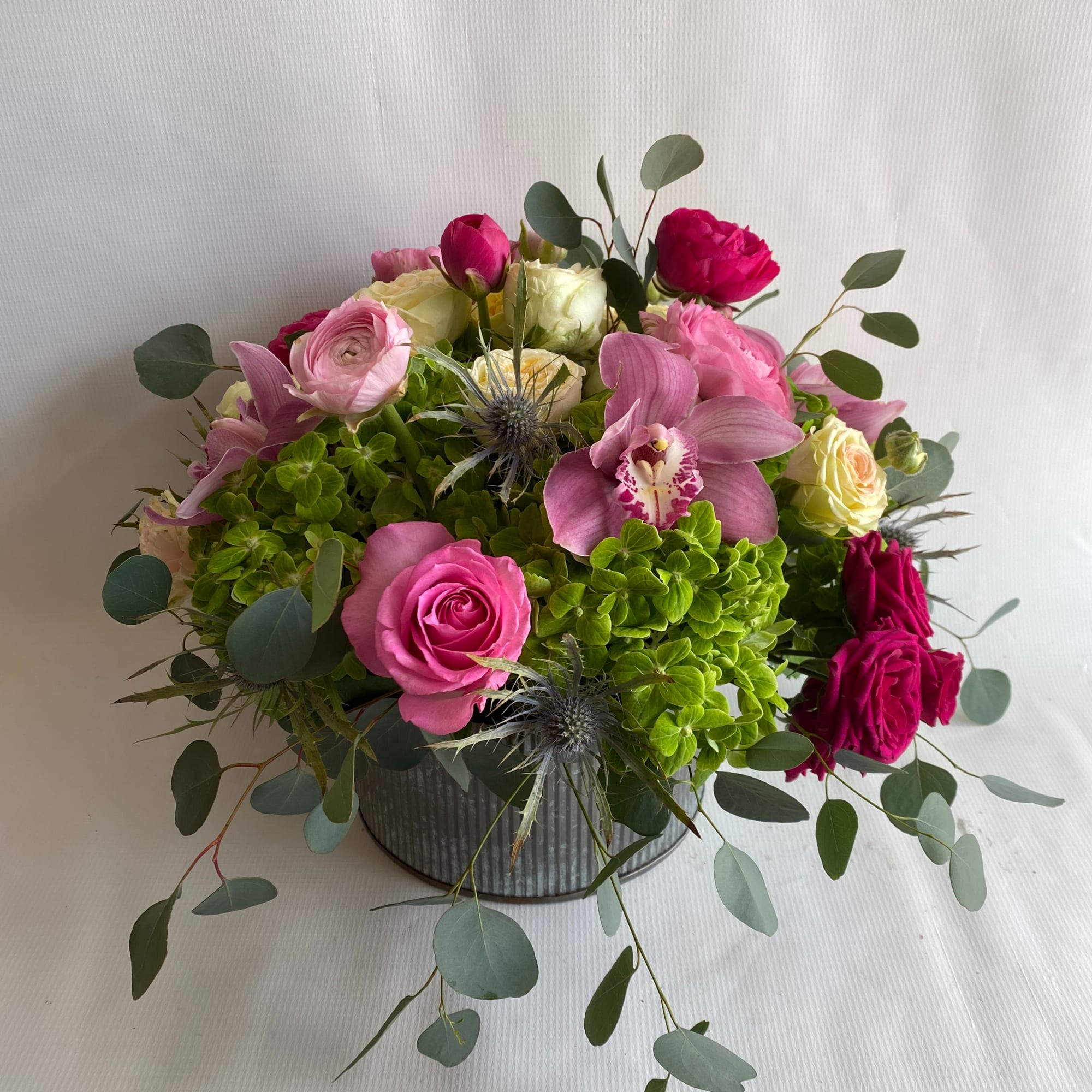 Experience a burst of vibrant colors with our stunning flower arrangement, featuring