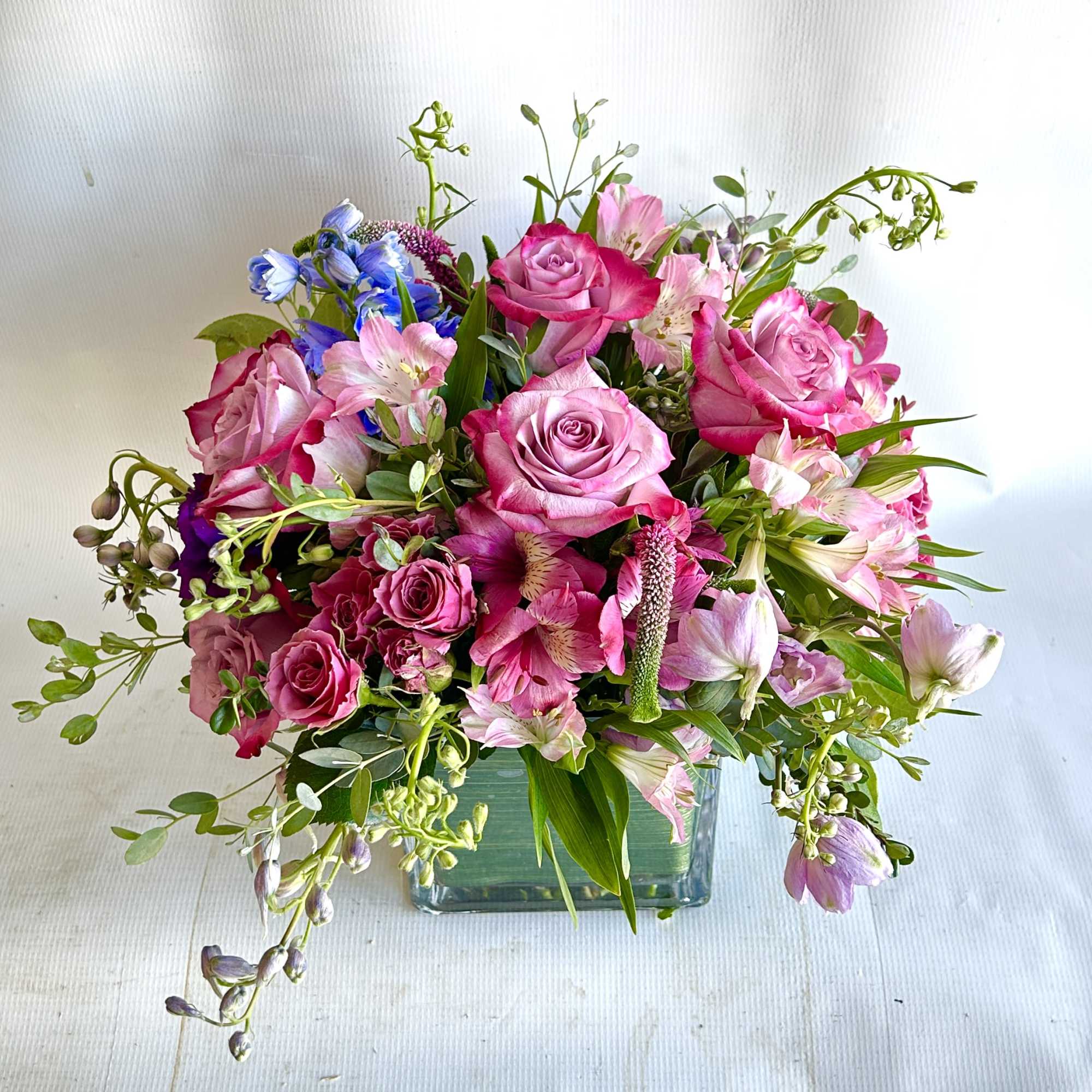 A delicate arrangement with roses, hydrangea, and dusty miller.

* cupcakes can be