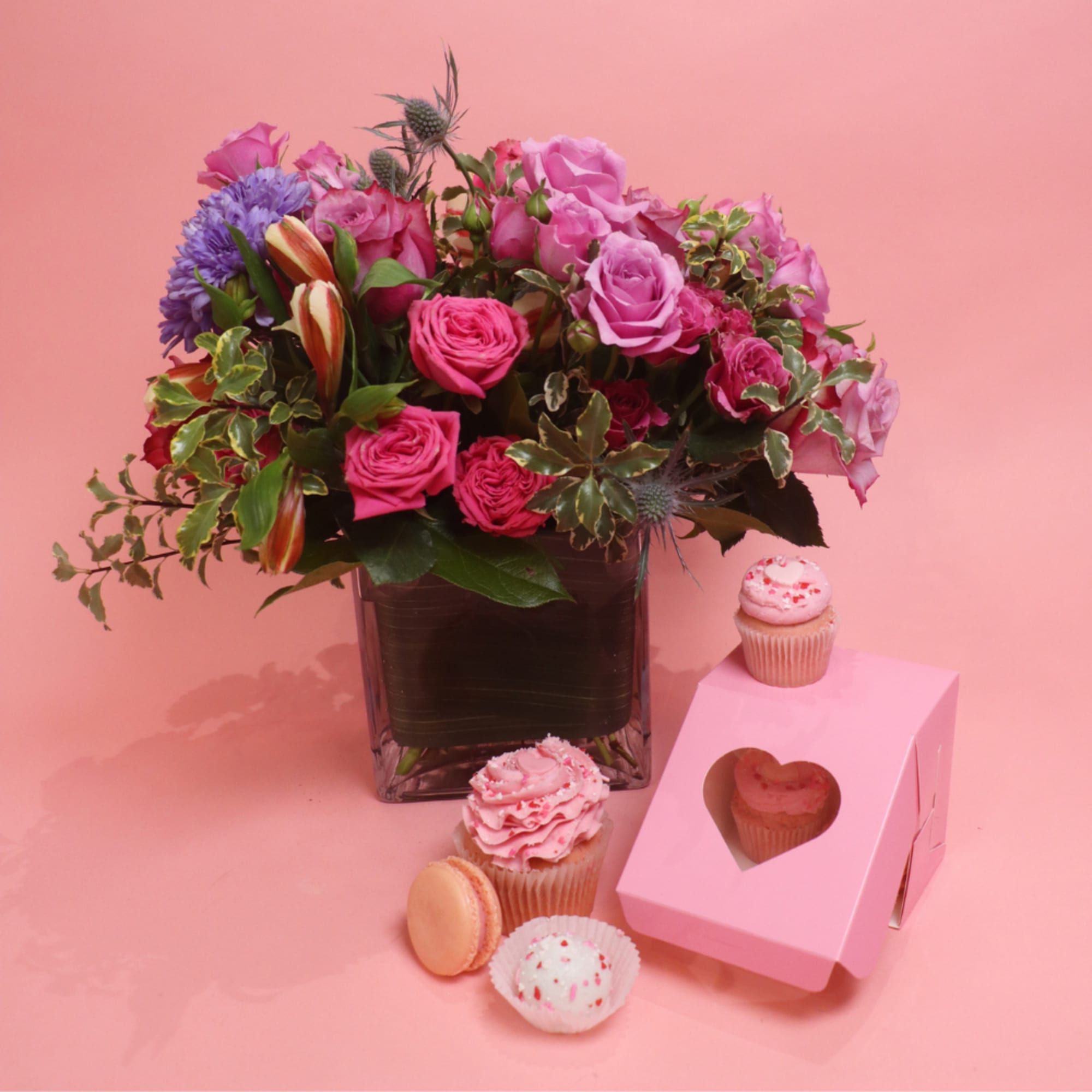 A delicate arrangement with roses, hydrangea, and dusty miller.

* cupcakes can be