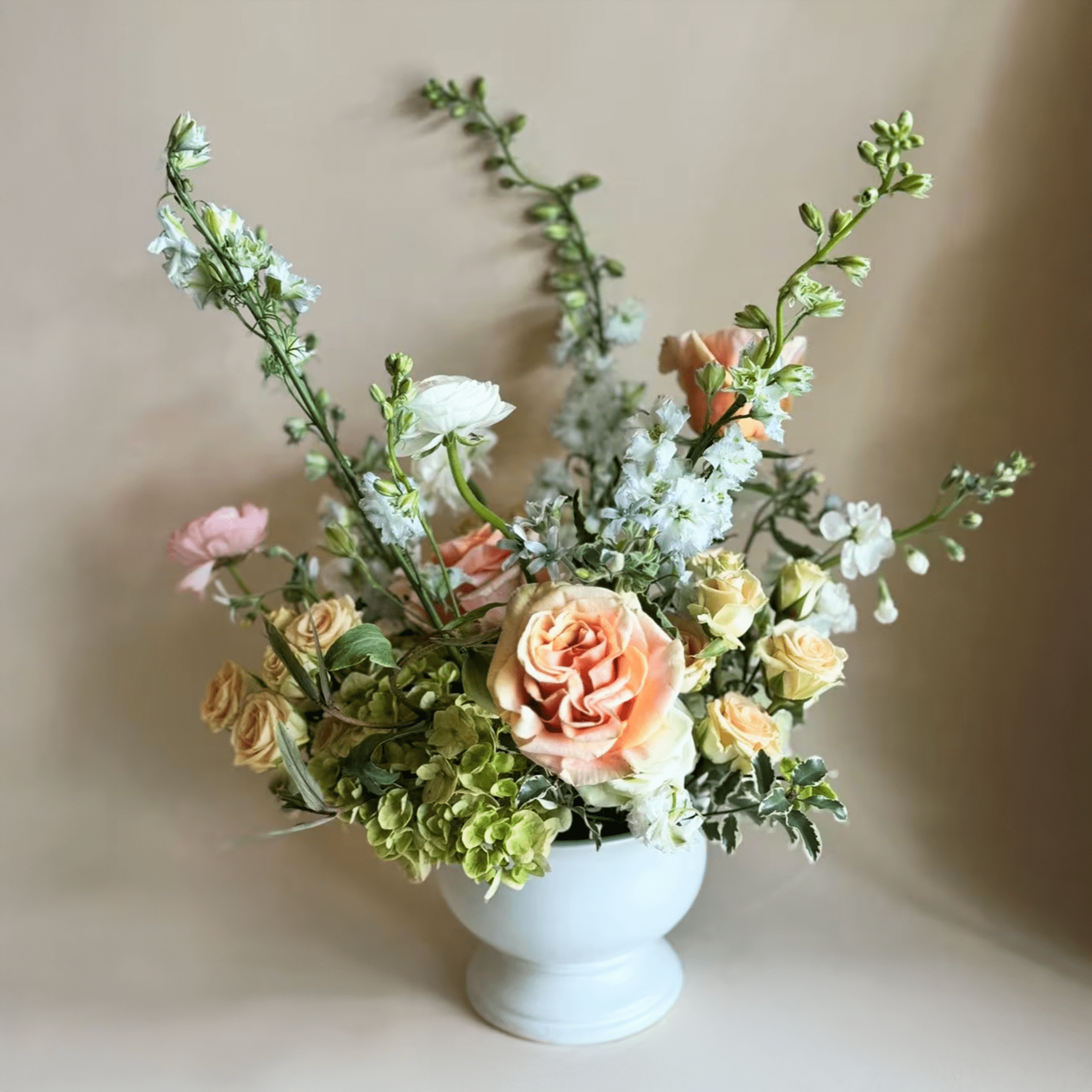 This garden-style floral arrangement captures the charm of a countryside bloom with