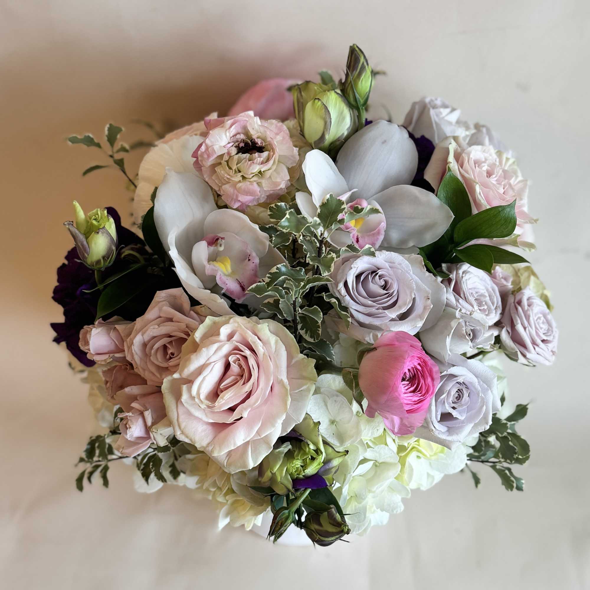 A romantic and elegant floral arrangement bursts with soft, complementary hues of, photo 3 of 3