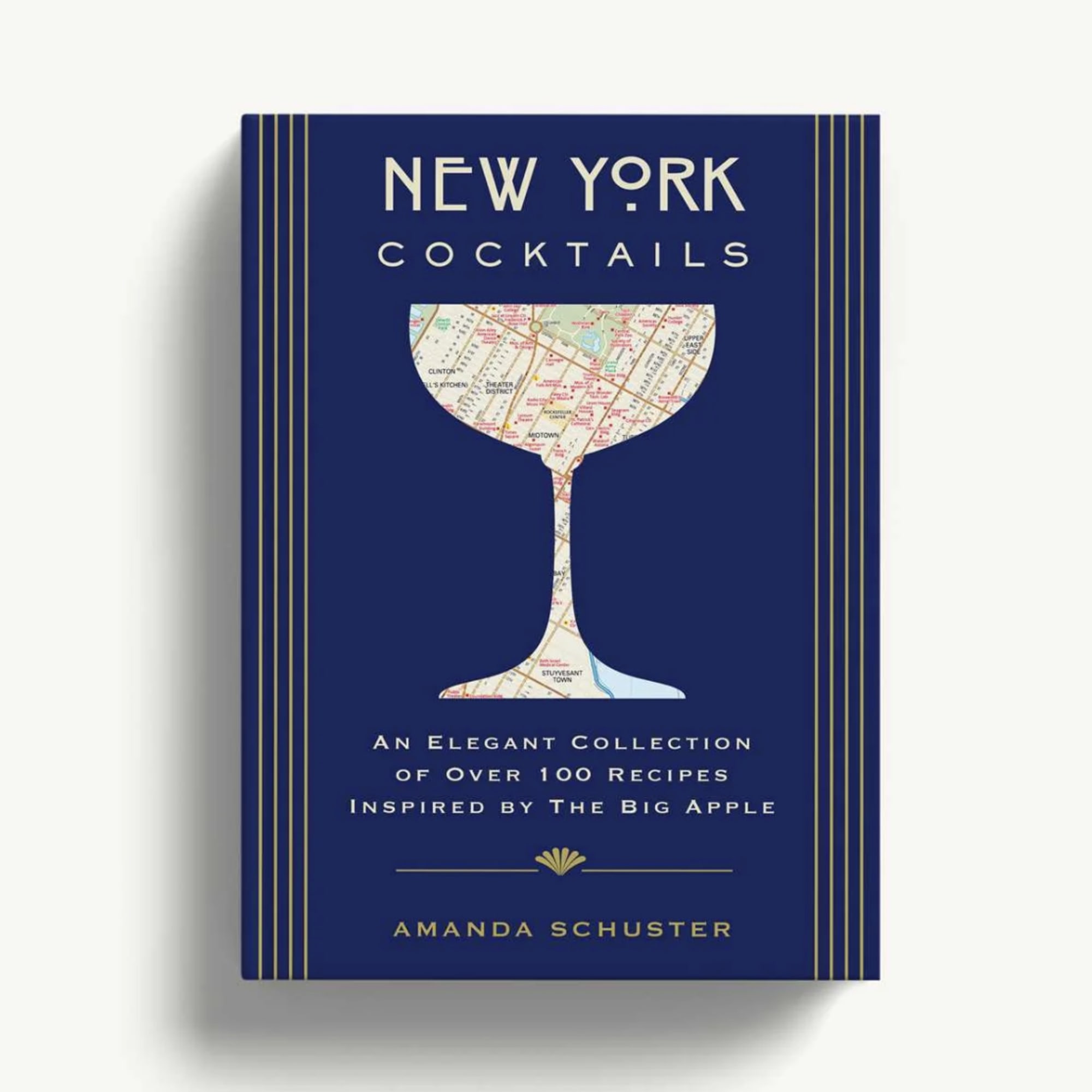 Blue cocktail recipe book with a map-filled martini glass illustration