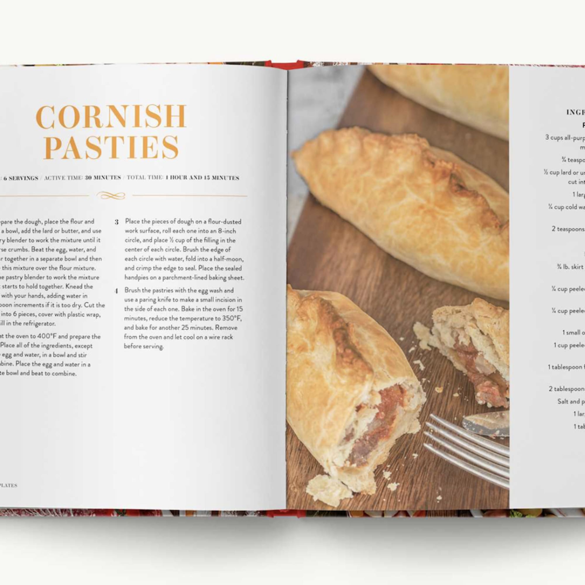 Open cookbook showing a Cornish pasties recipe with a photo of baked pastries