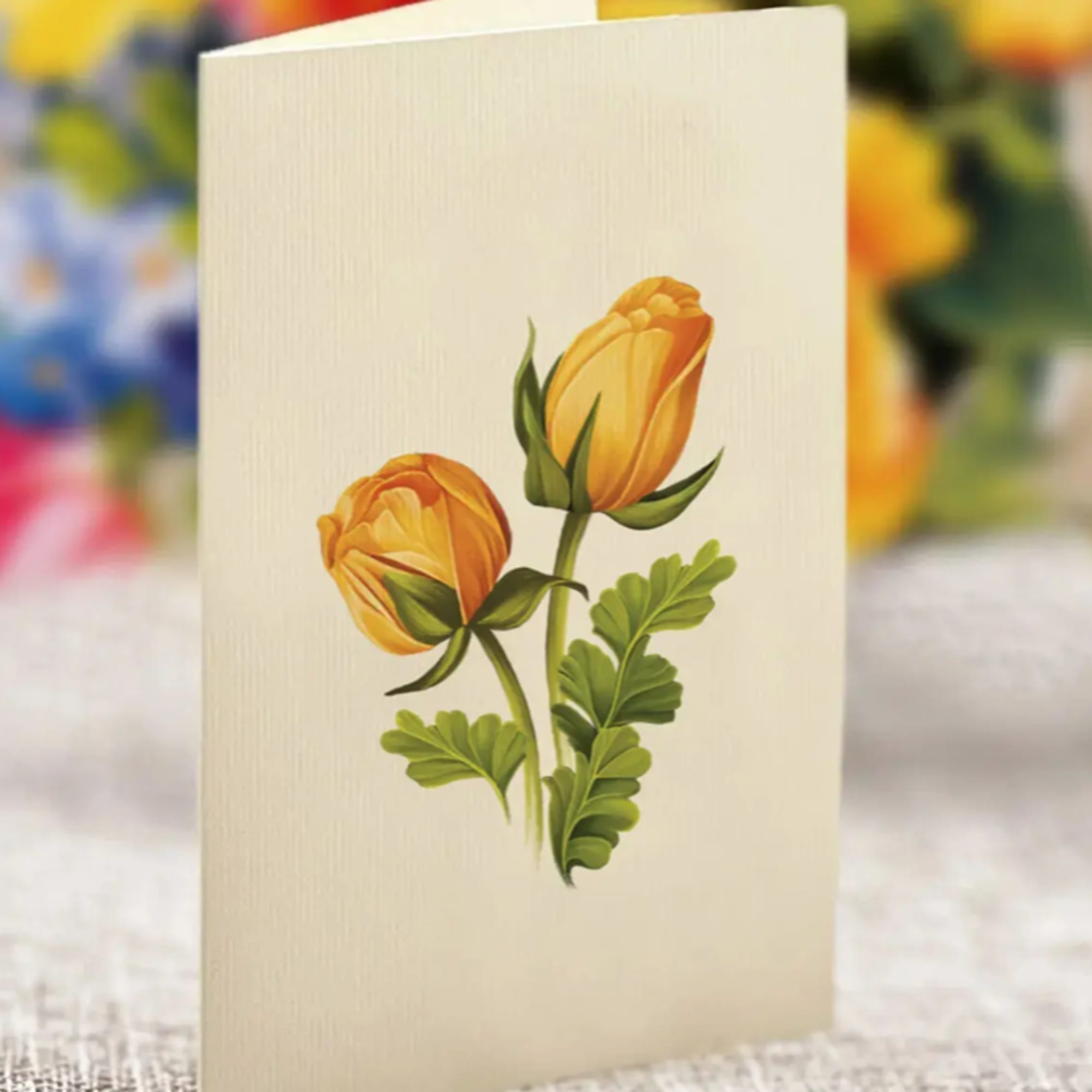 Cream folded card with two orange-yellow tulip illustrations