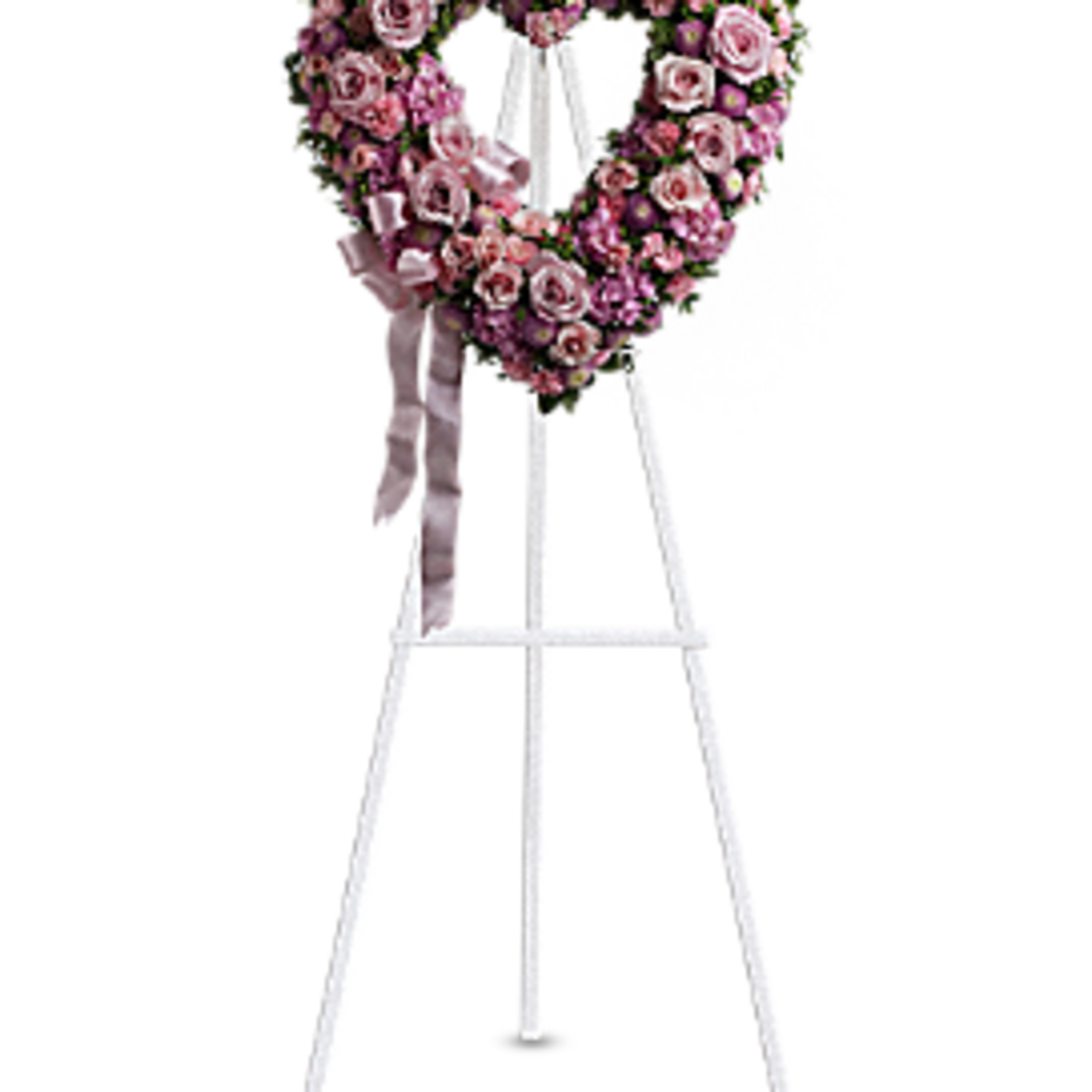 Heart-shaped pink rose wreath on a white easel with ribbon