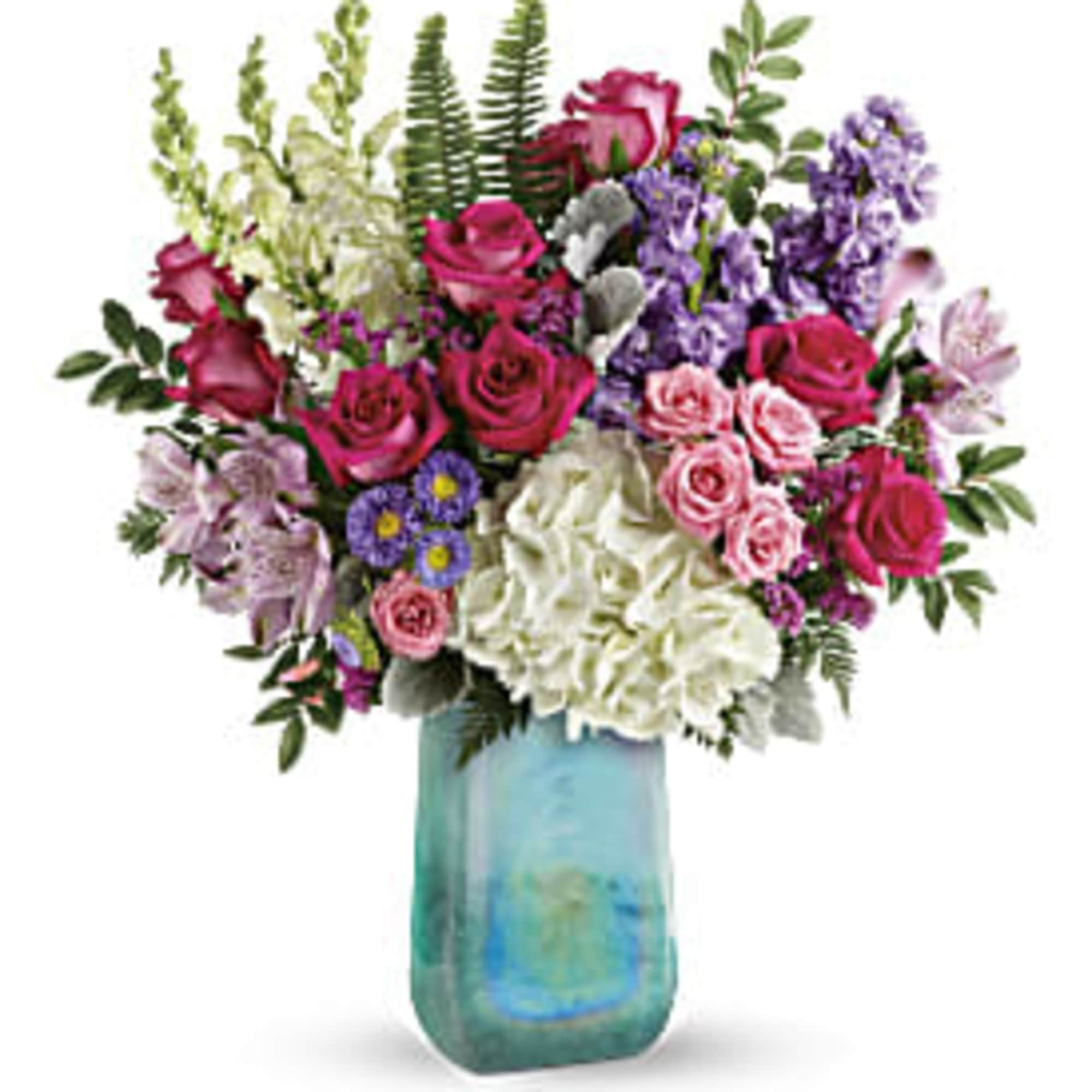 Mixed bouquet of roses, hydrangeas, and purple flowers in a blue vase