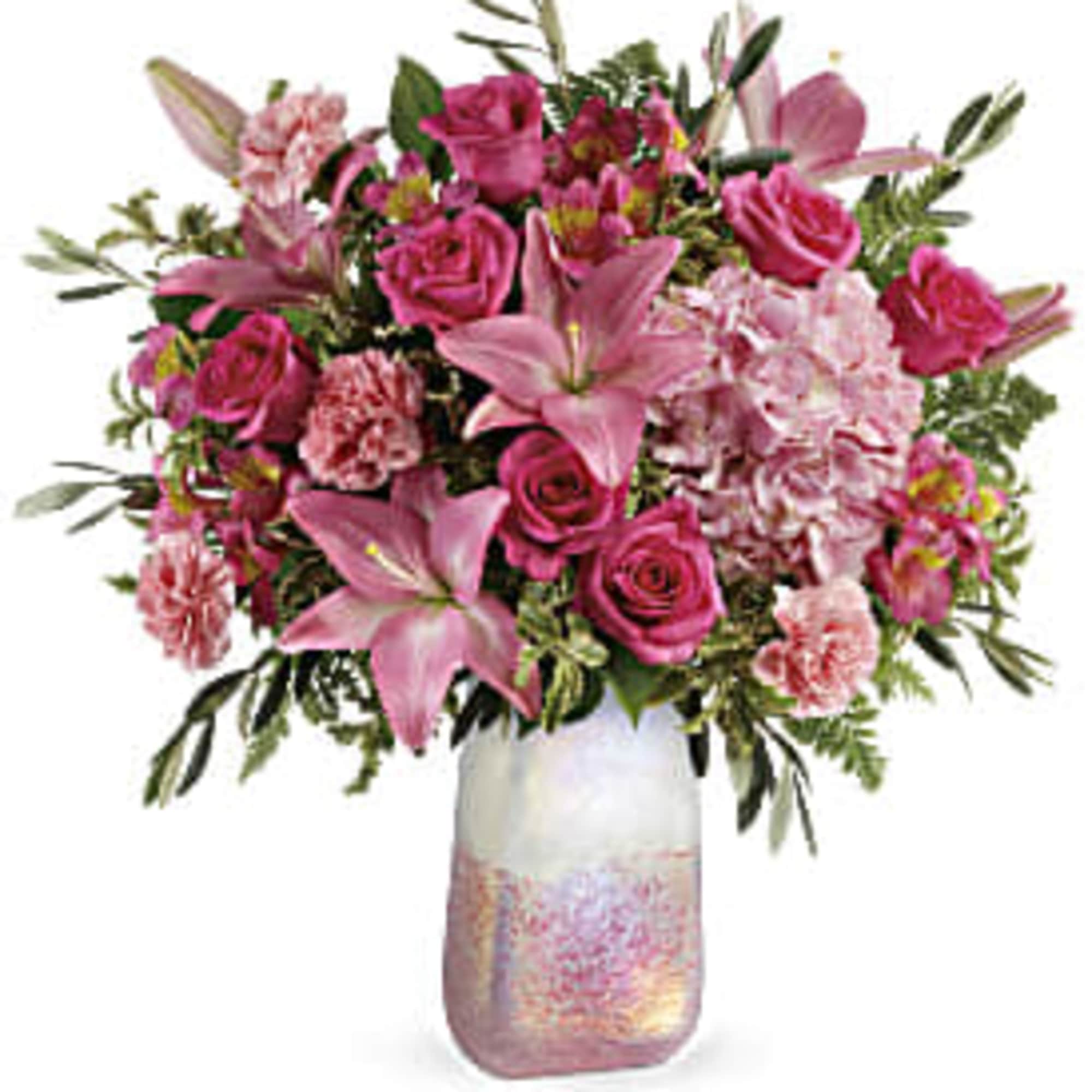 Pink roses and lilies arranged in a glass vase