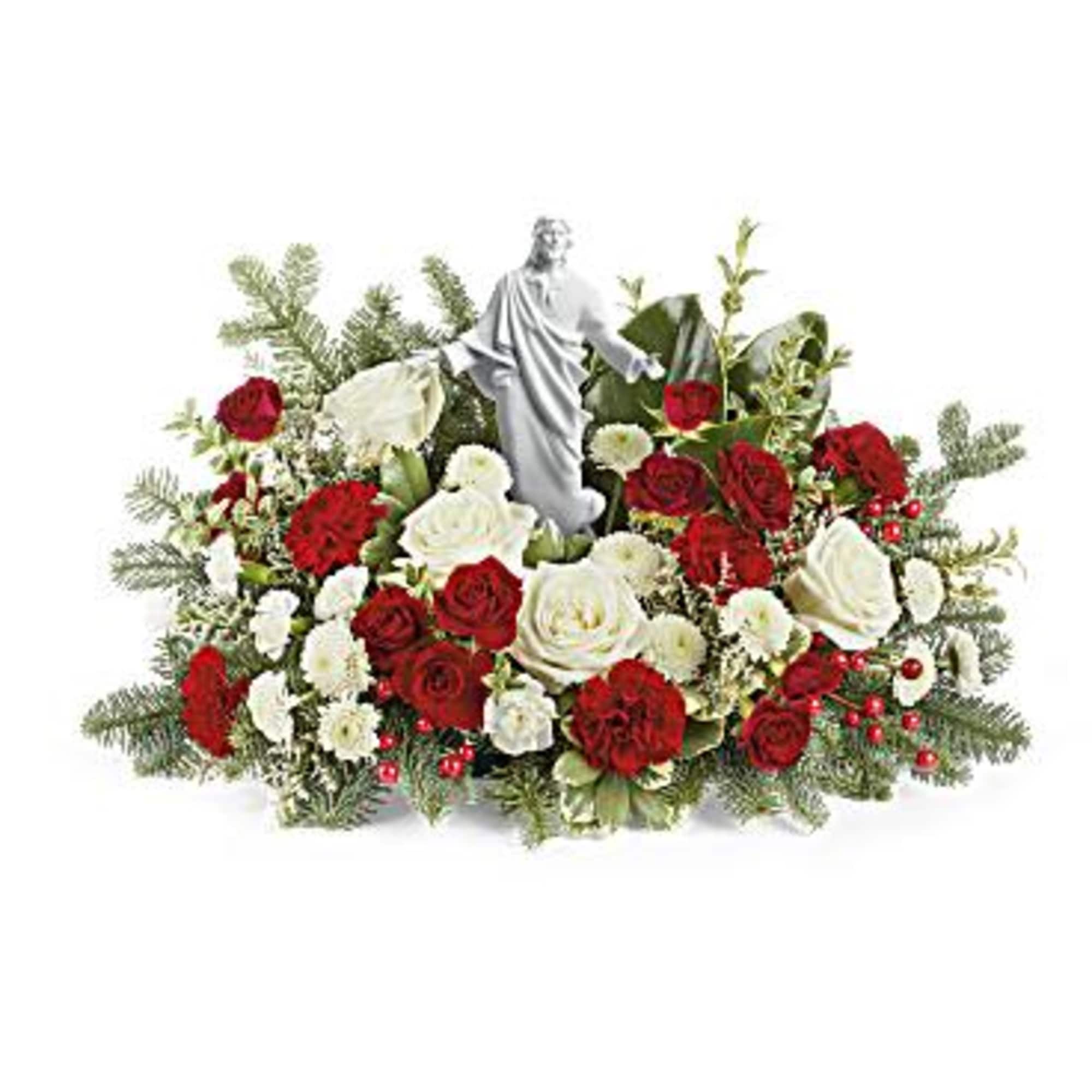 Red and white rose arrangement with a small statue centerpiece