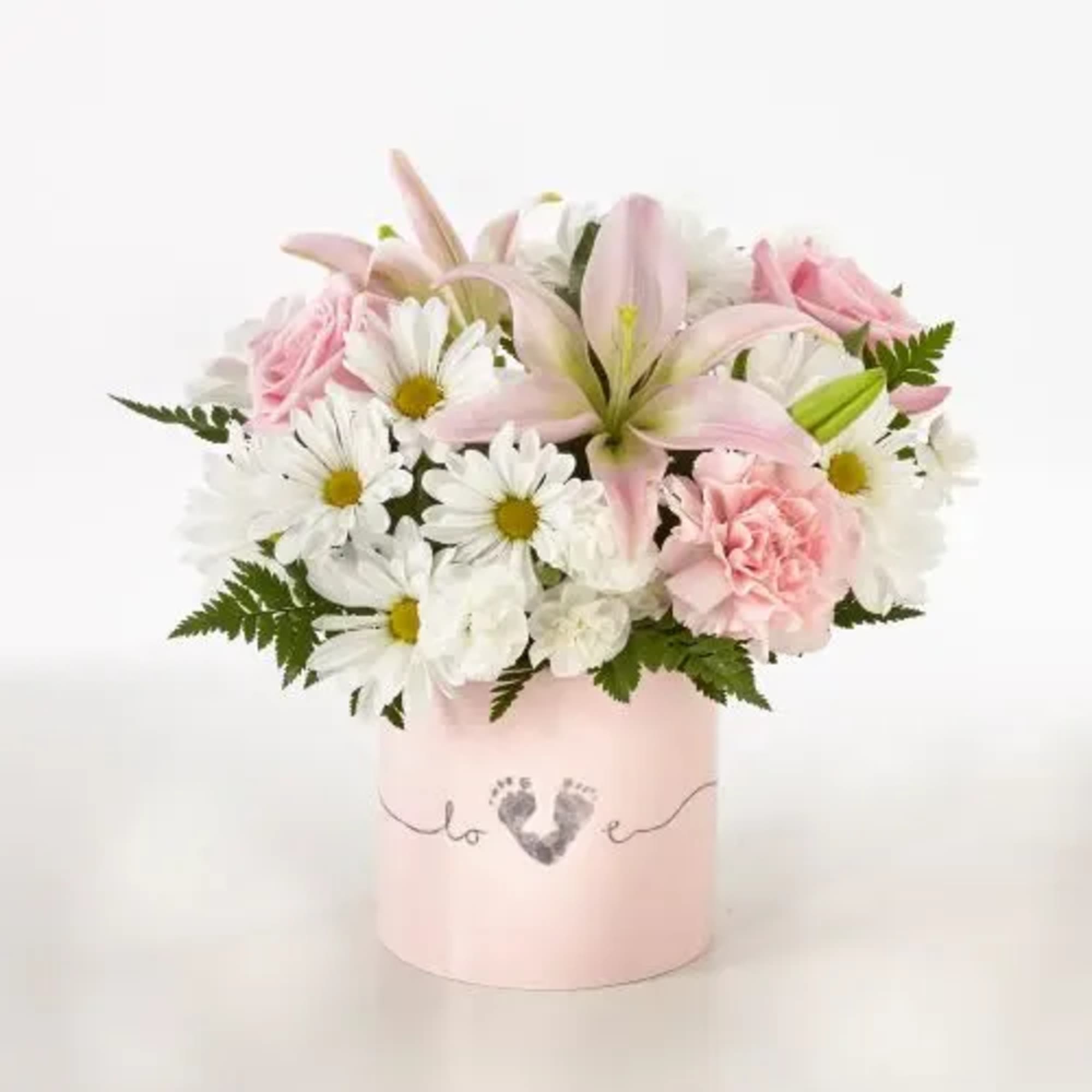 Pink and white bouquet in a pale pink box with a heart design