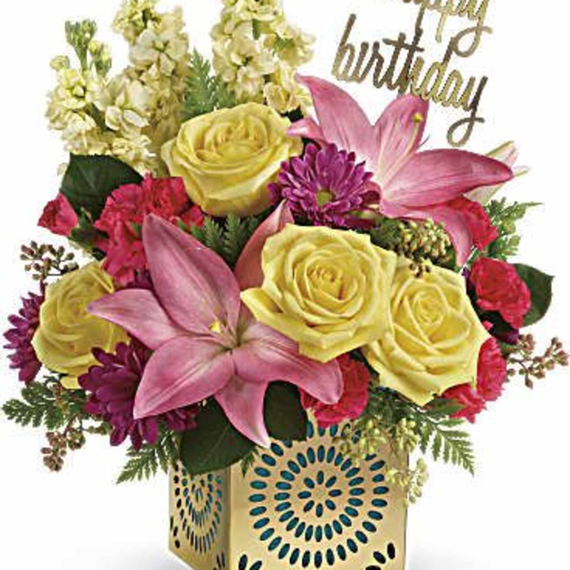 Birthday floral arrangement with yellow roses, pink lilies, and bright blooms in a gold patterned cube vase