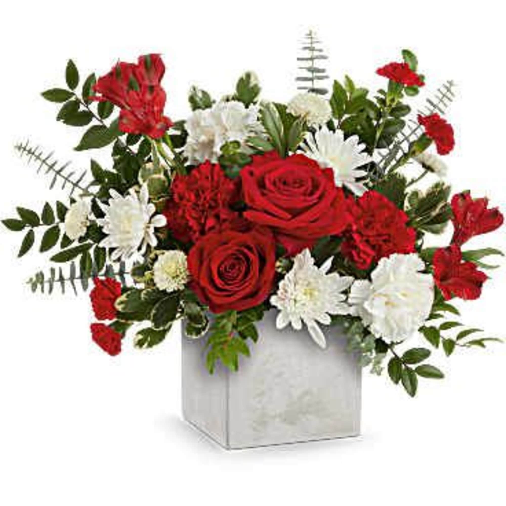 Red roses and white daisies in a square vase
