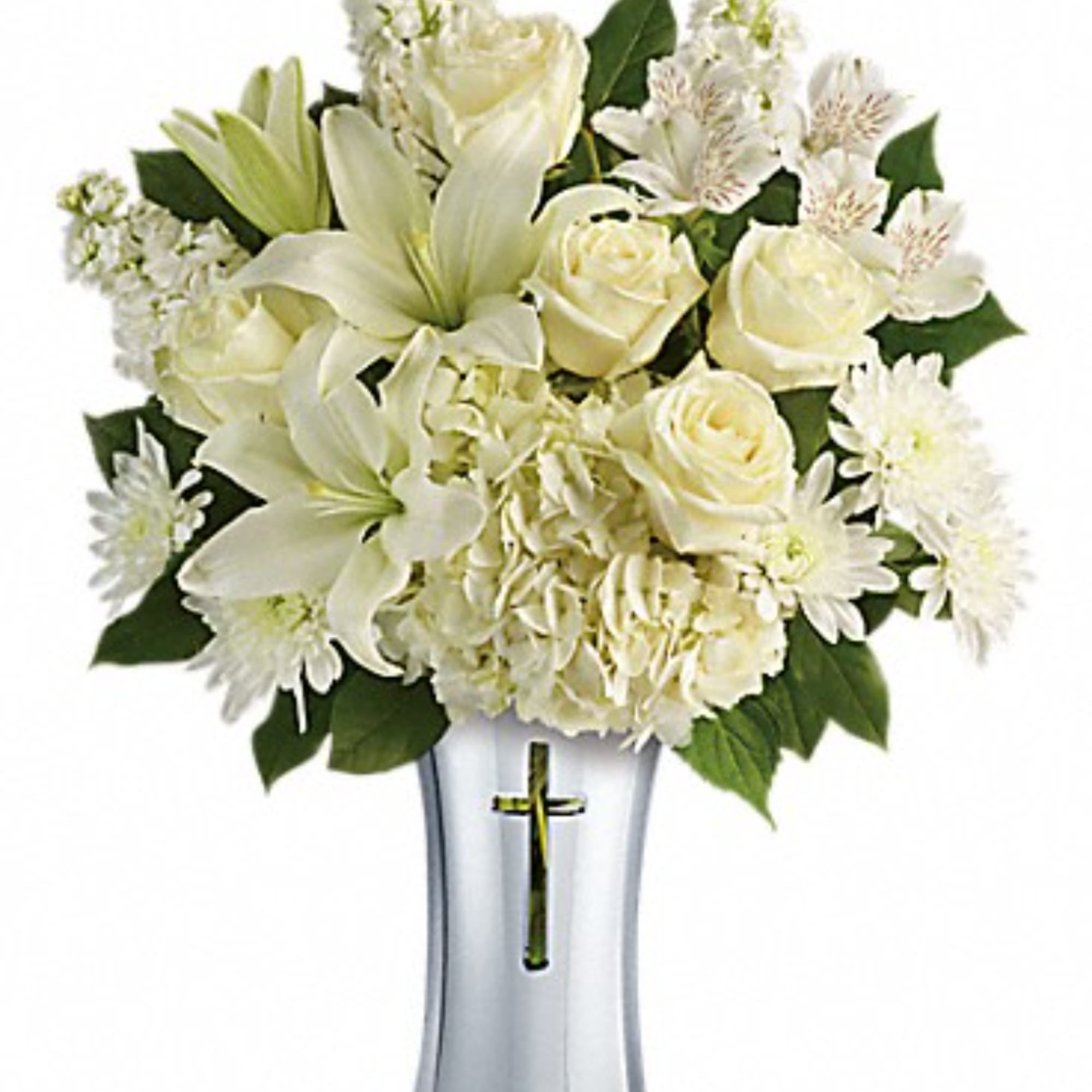 White lilies, roses, and daisies arranged in a clear vase