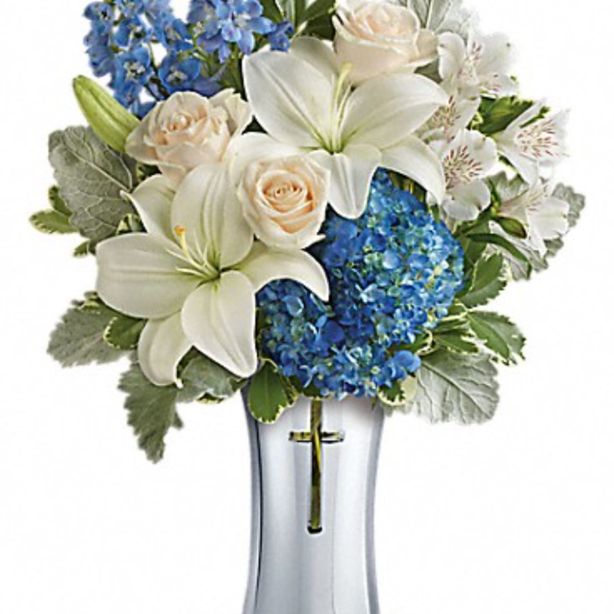 White lilies, cream roses, and blue hydrangeas in a clear vase