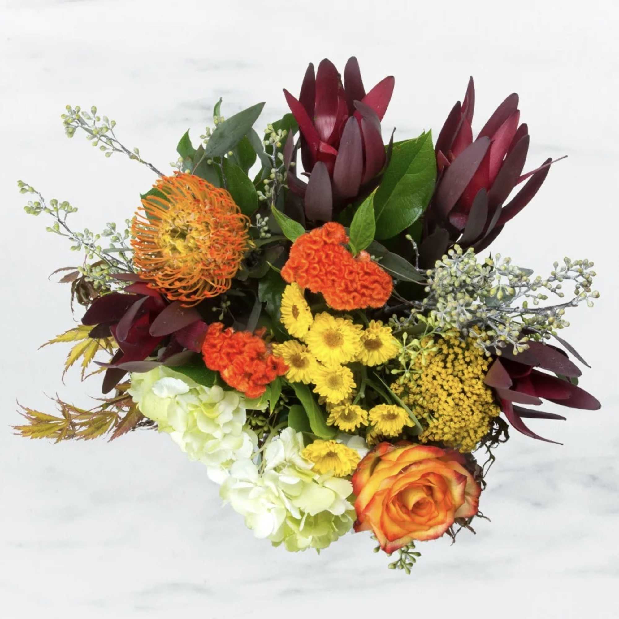 This arrangement brings meaning to the word "Happiness" with spring flowers designed, photo 2 of 2
