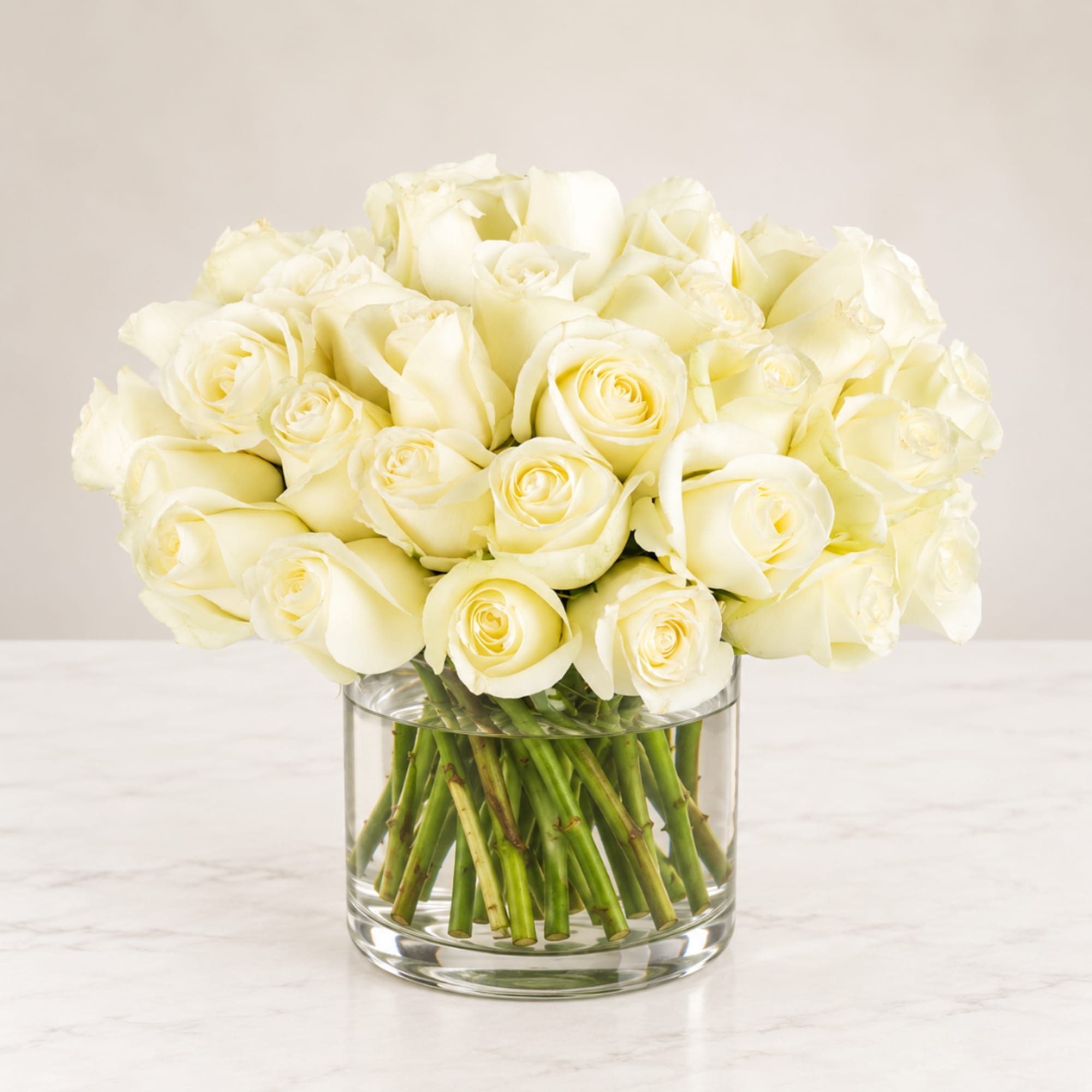Bouquet of white roses in a clear glass vase