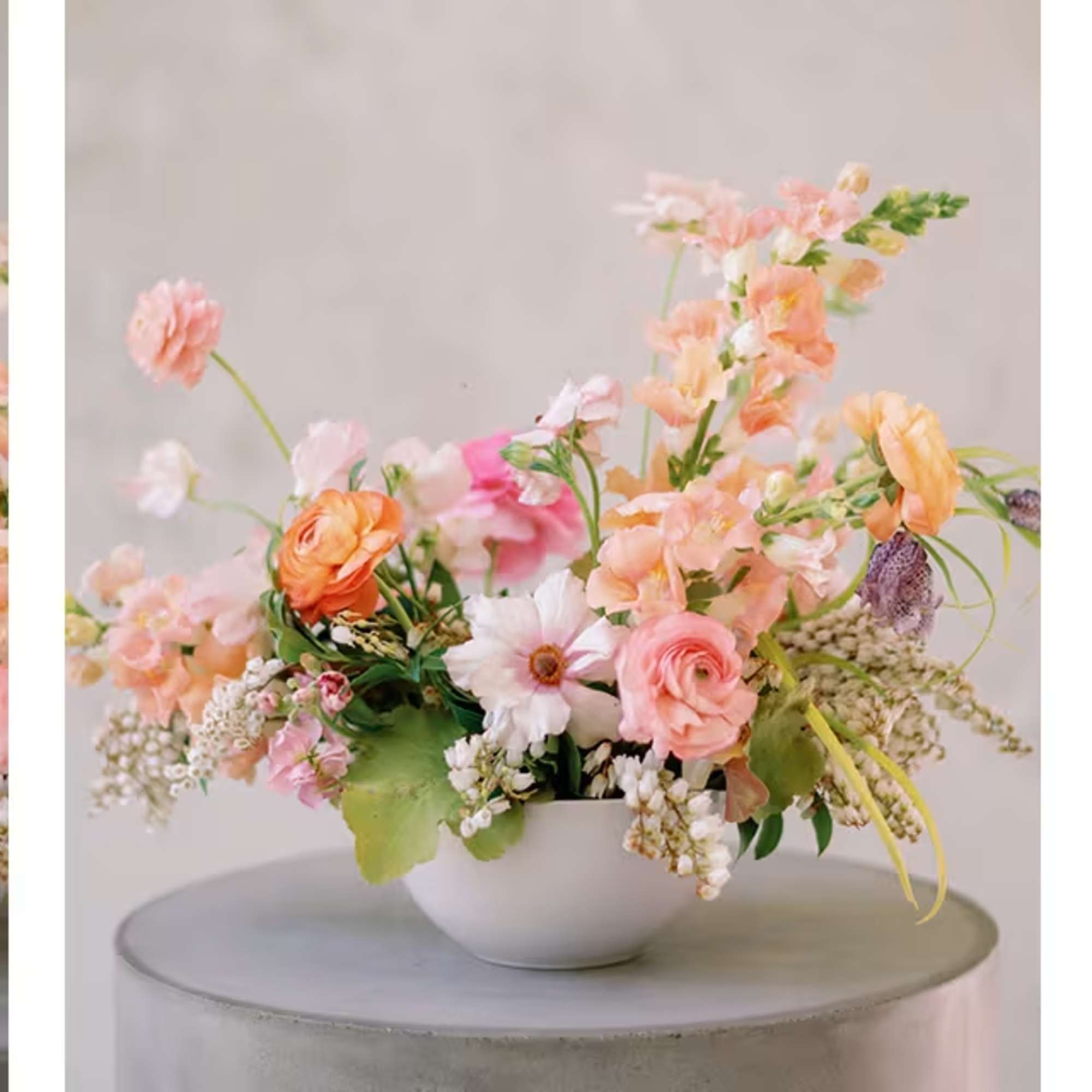 Pastel floral arrangement in a white bowl vase