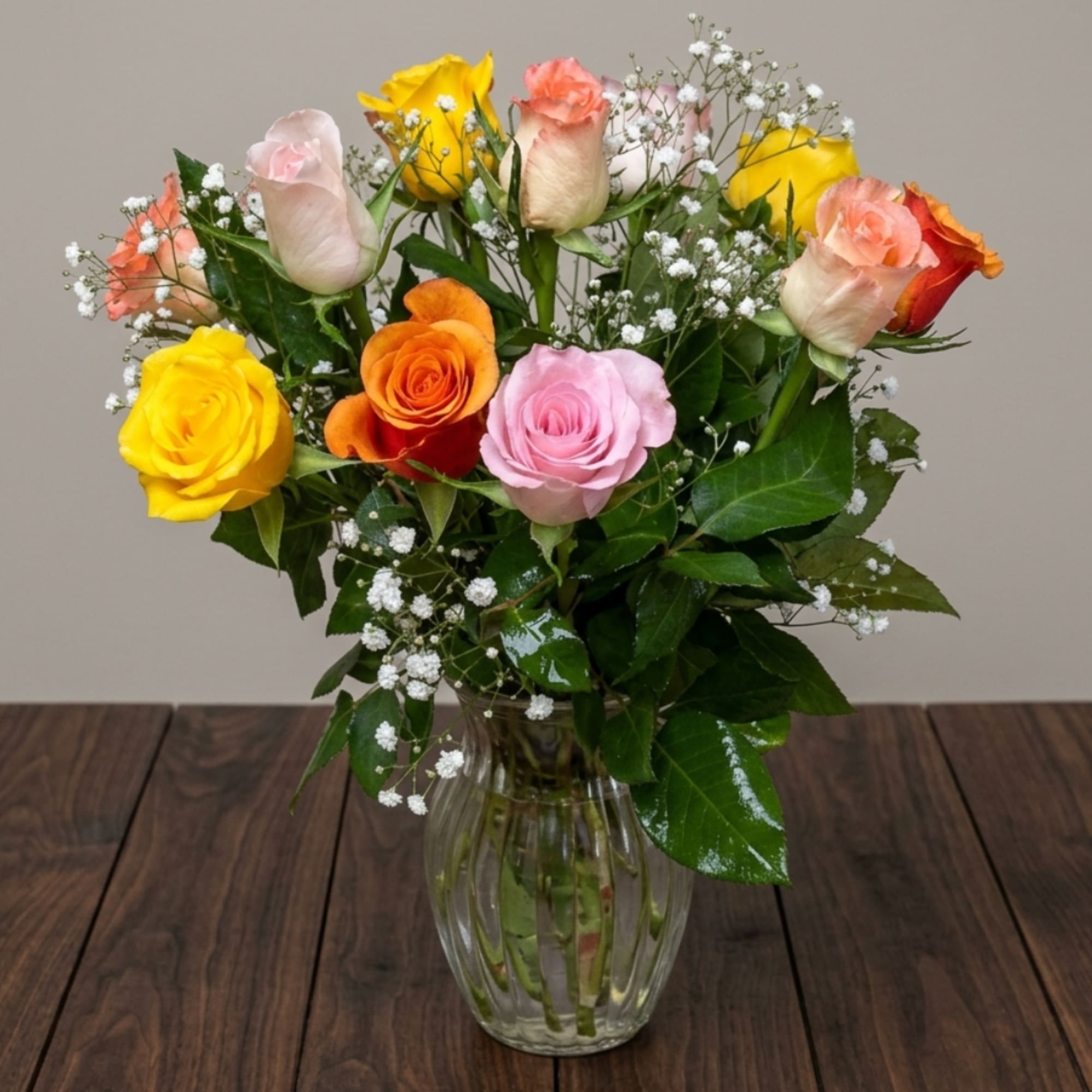 Mixed roses in a clear glass vase with baby's breath, photo 3 of 3