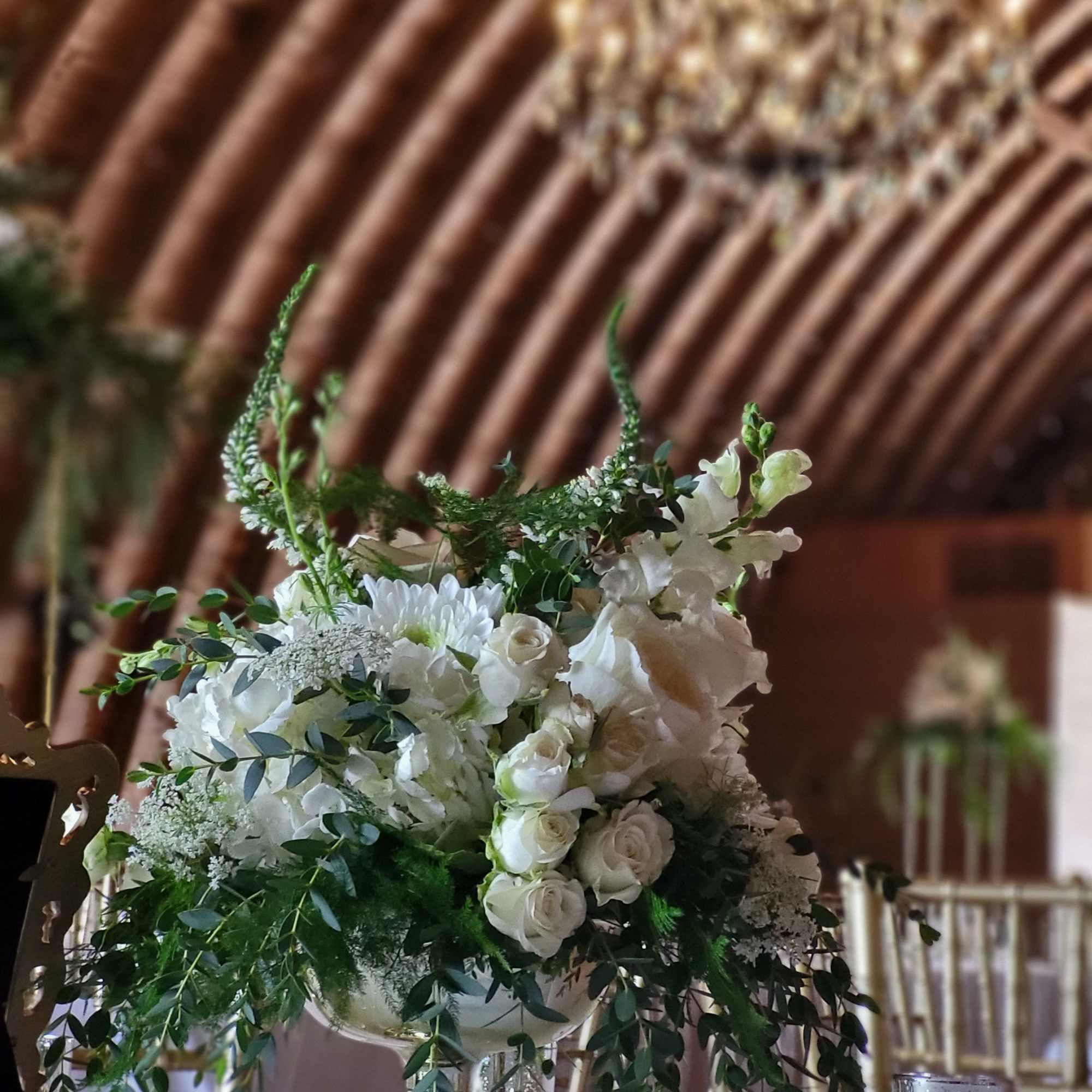 White floral centerpiece in a gold pedestal vase, photo 2 of 2