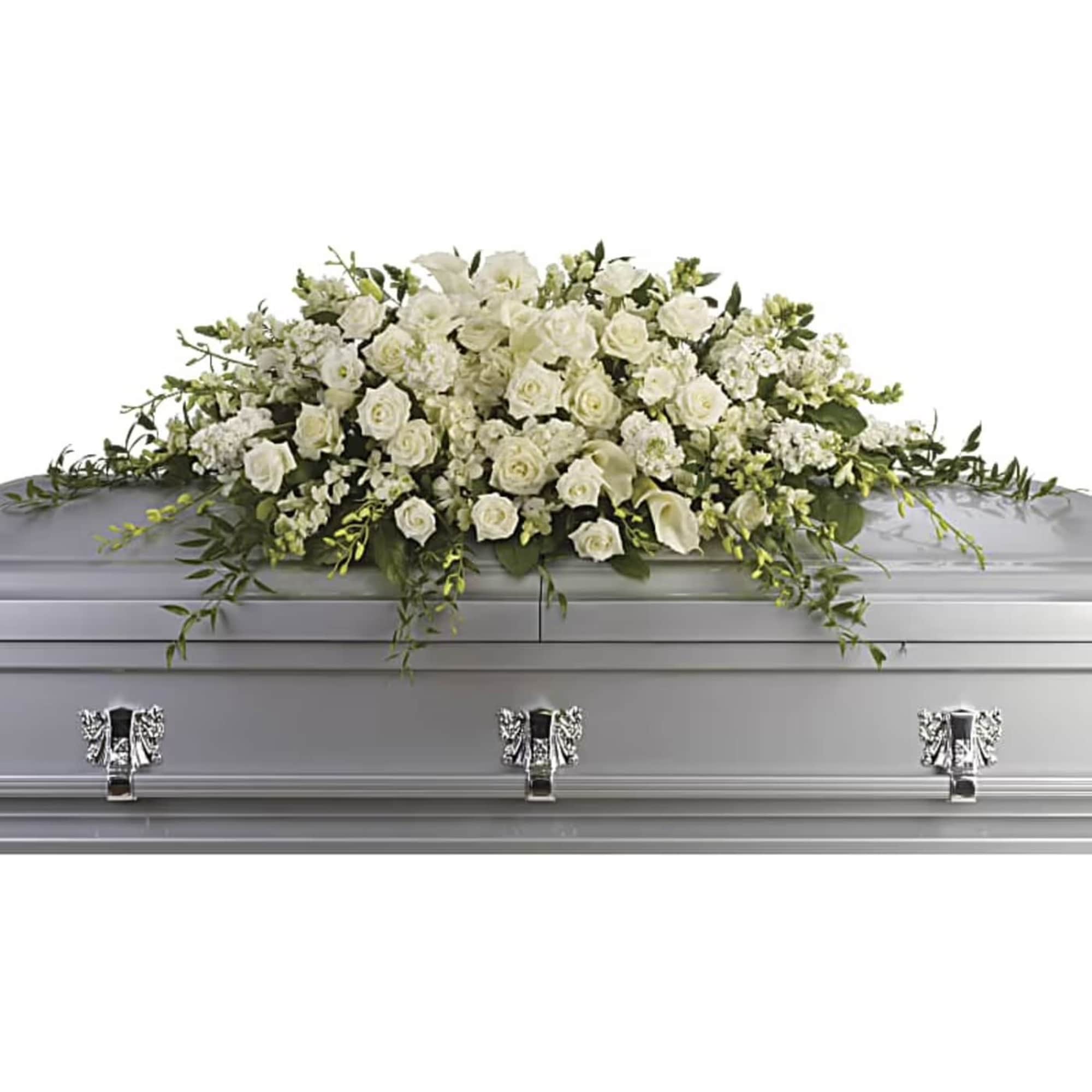 White floral casket spray on a silver casket