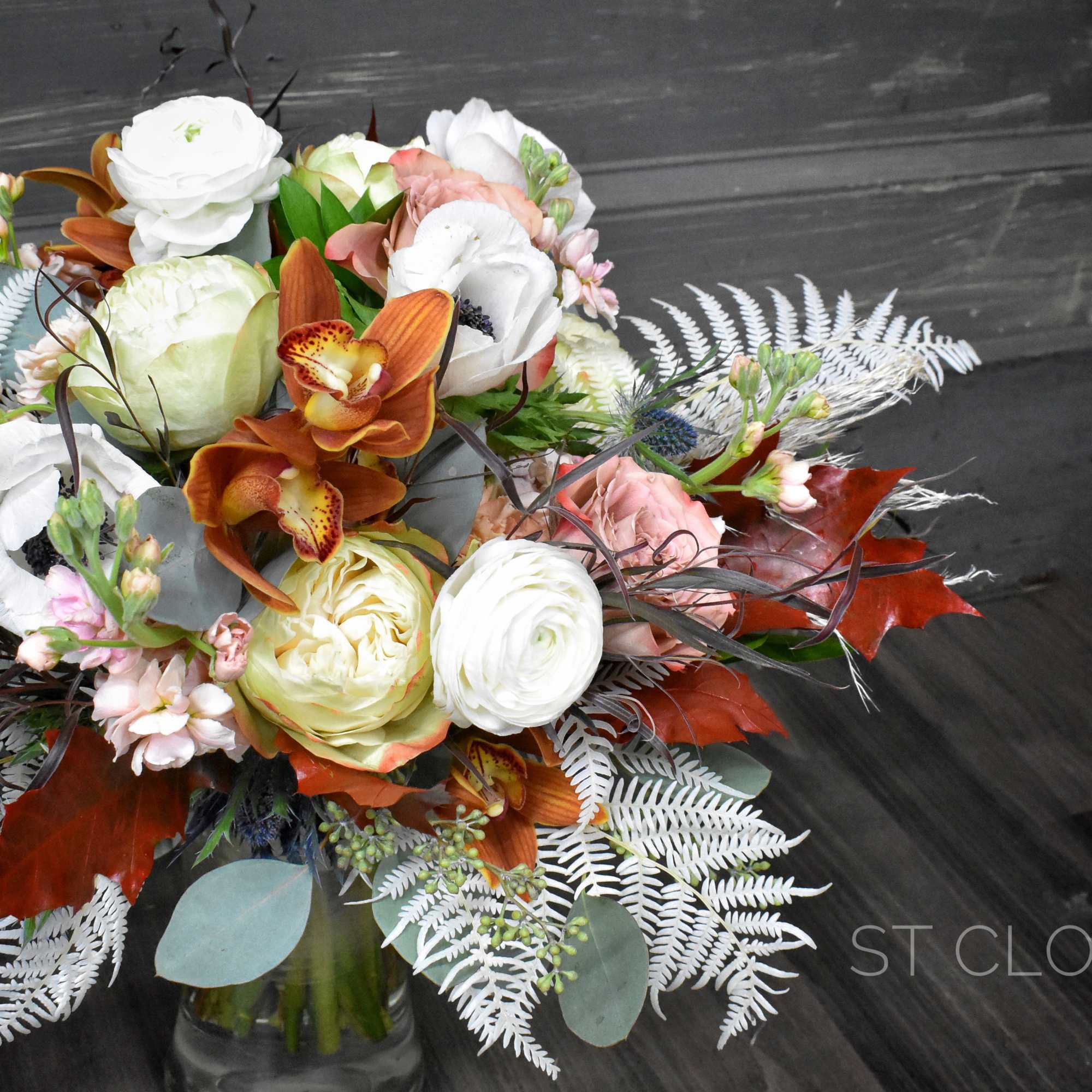 Bouquet of white and peach flowers in a glass vase