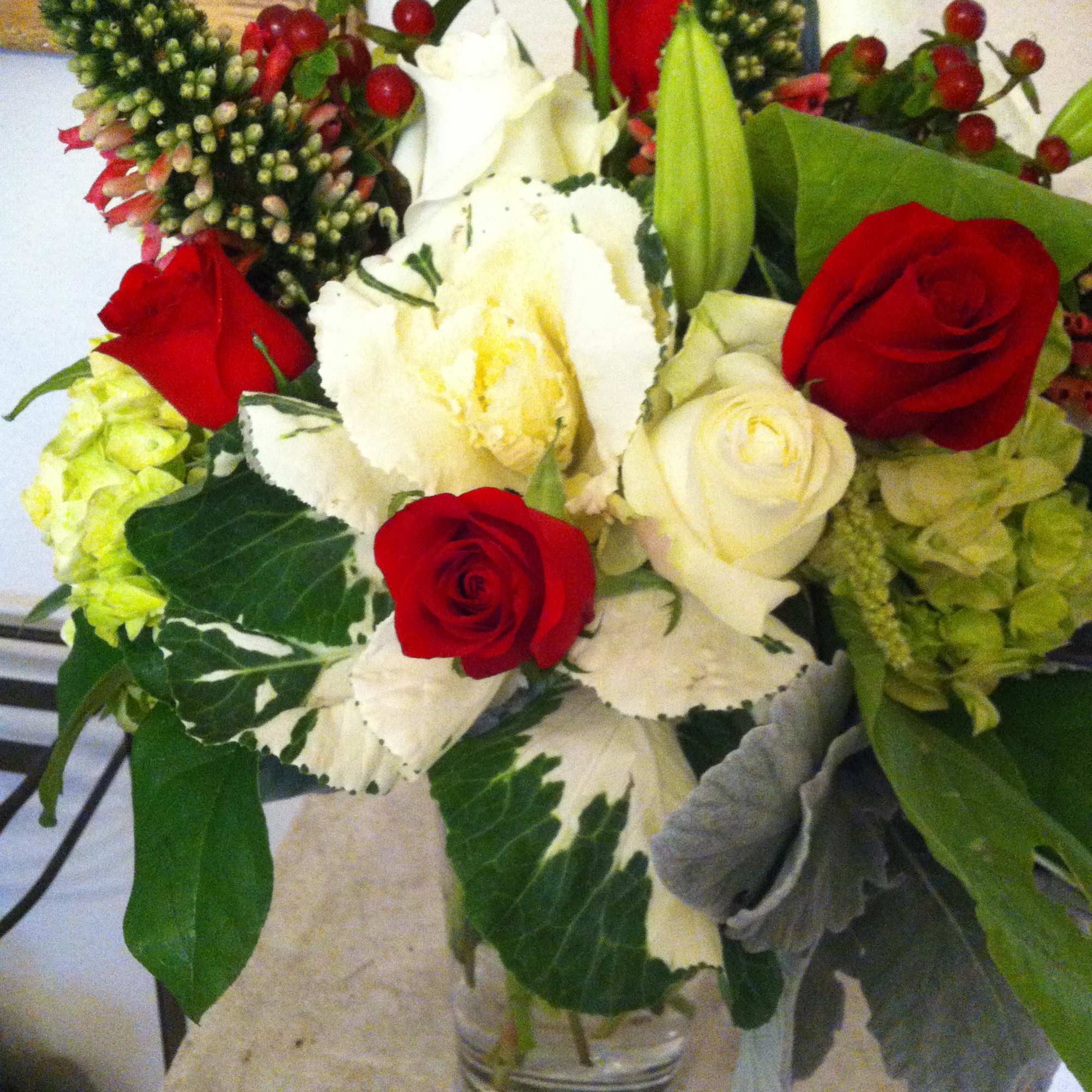 Bouquet of red and white roses in a clear glass vase