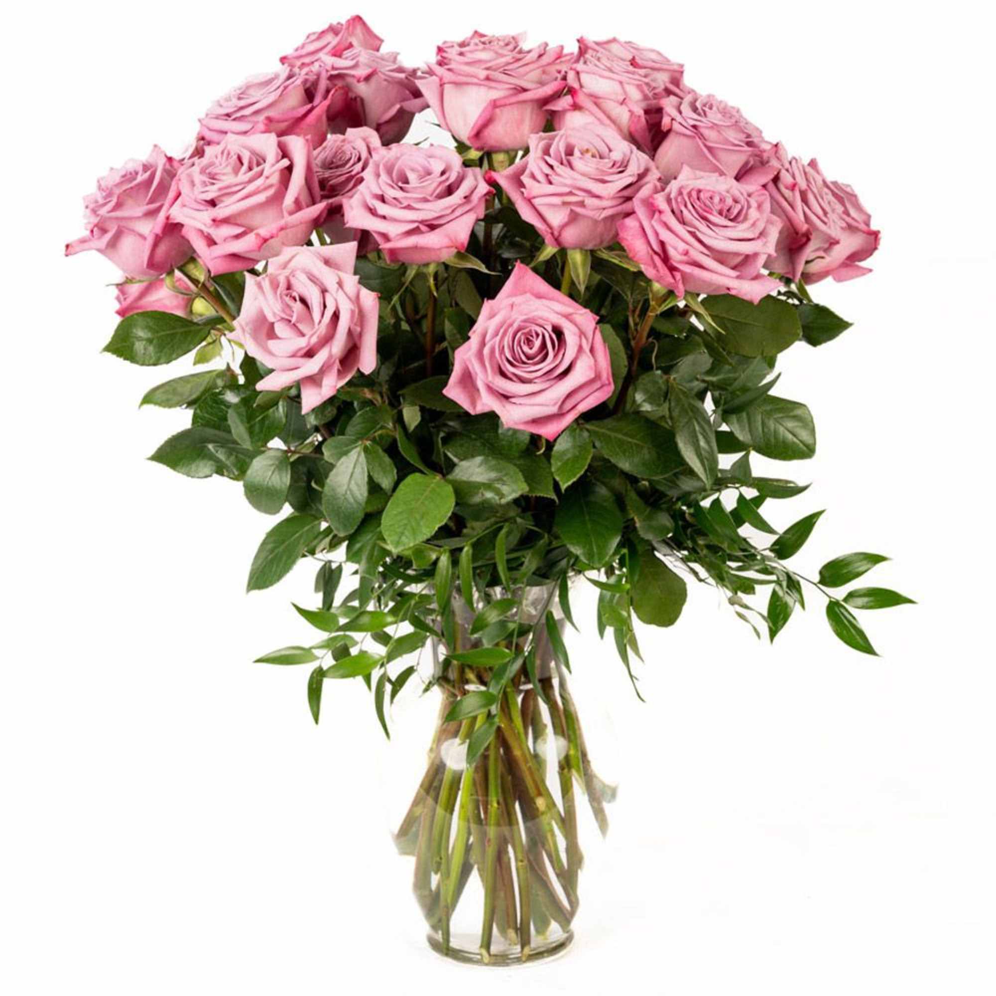 Tall arrangement of pink roses in a clear glass vase