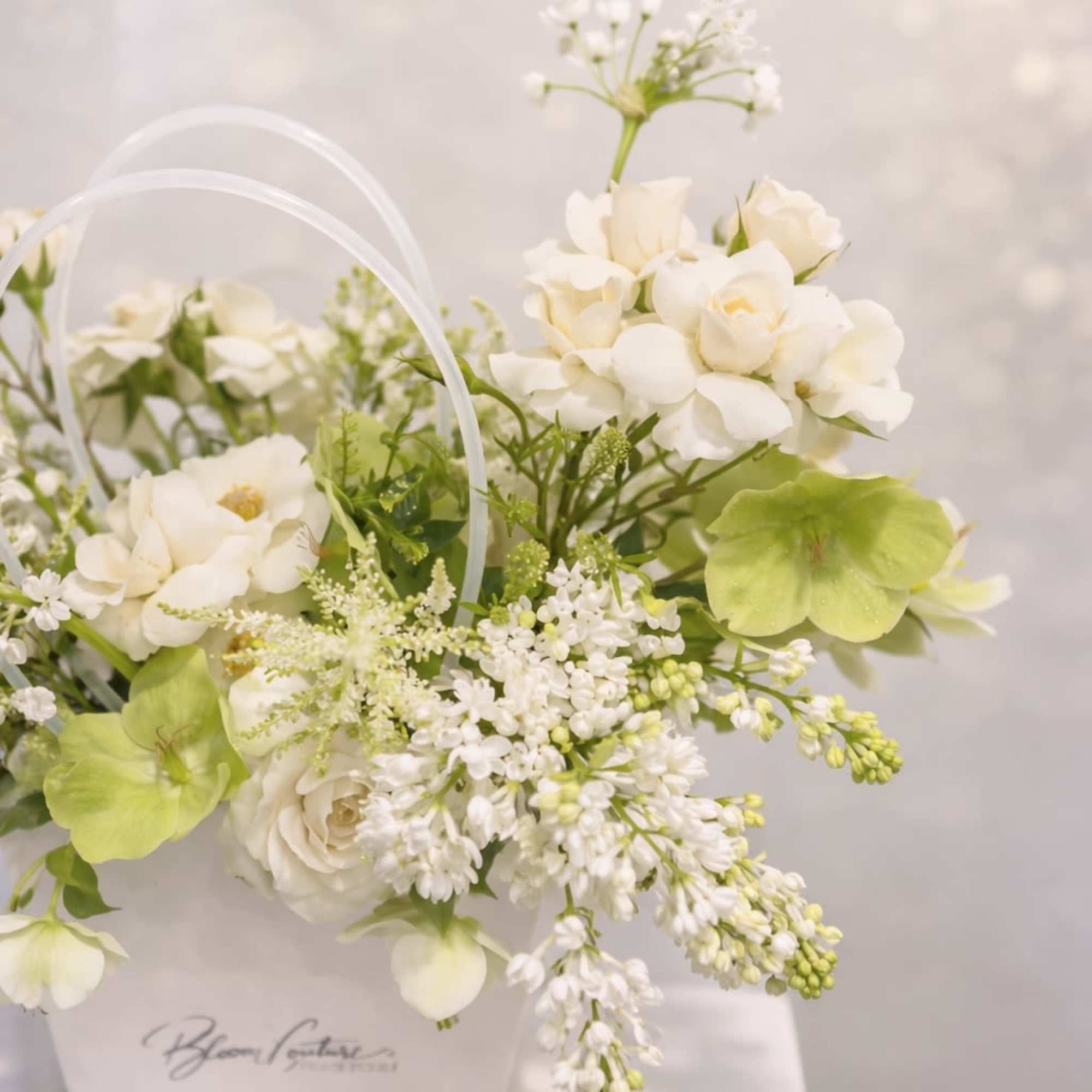 A fresh and elegant garden-style arrangement designed with premium seasonal flowers in, photo 2 of 3