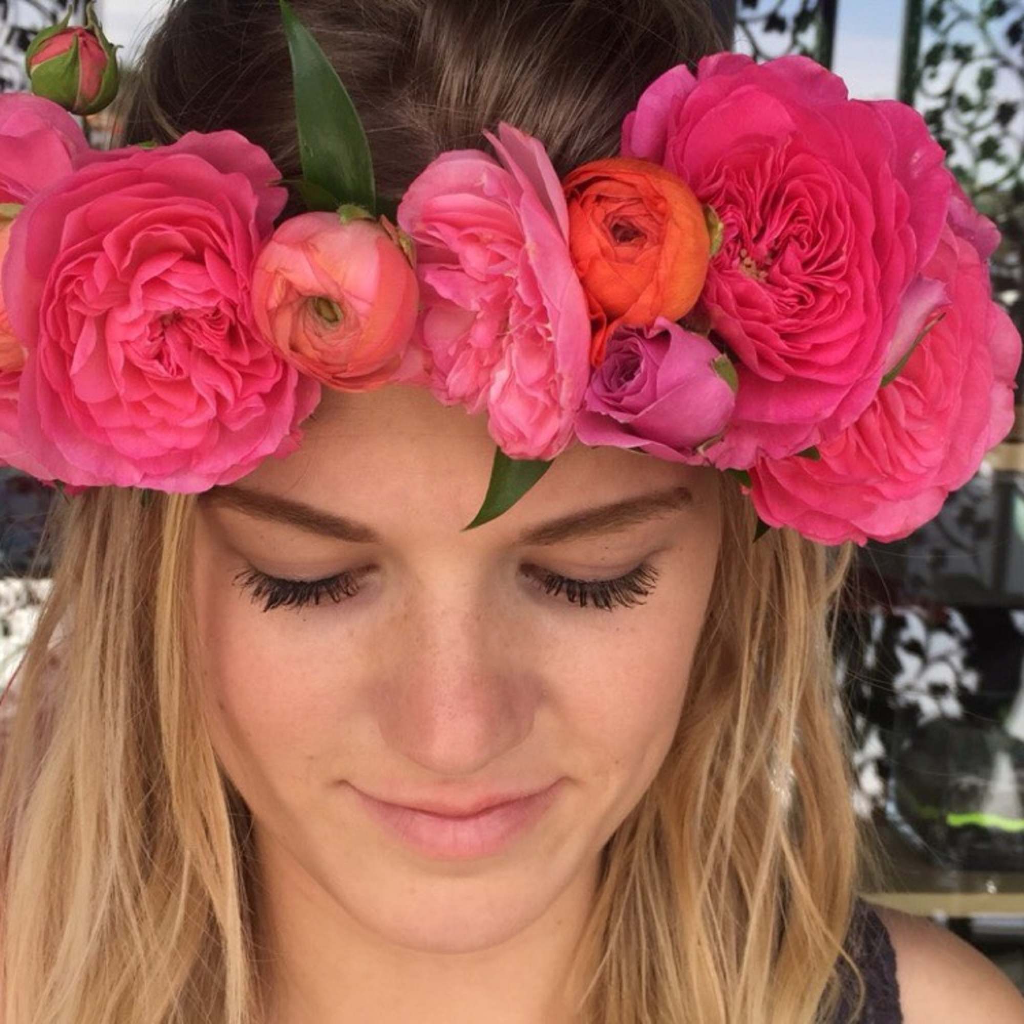 Woman wearing a pink flower crown on her head