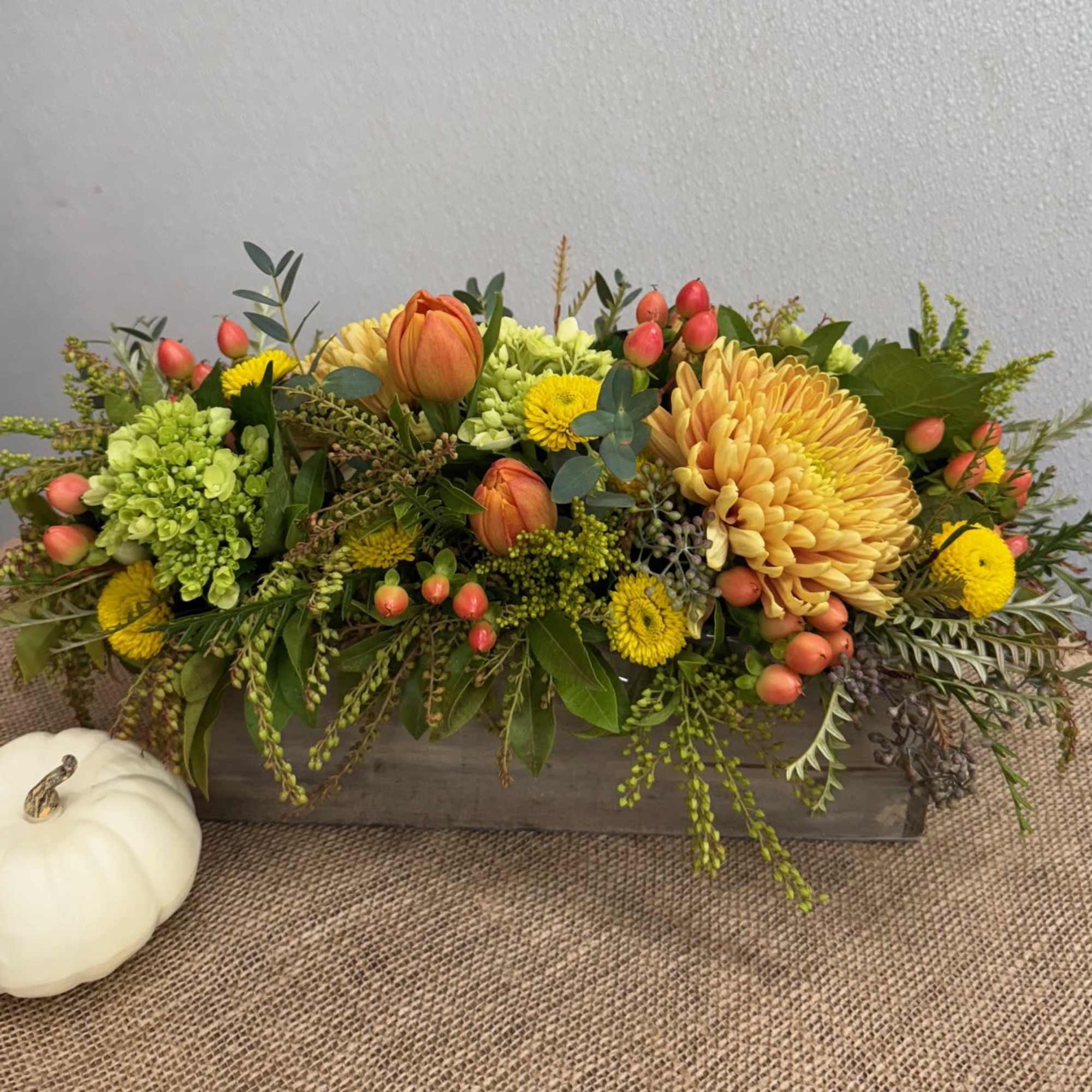 Wooden box with fresh seasonal flowers.