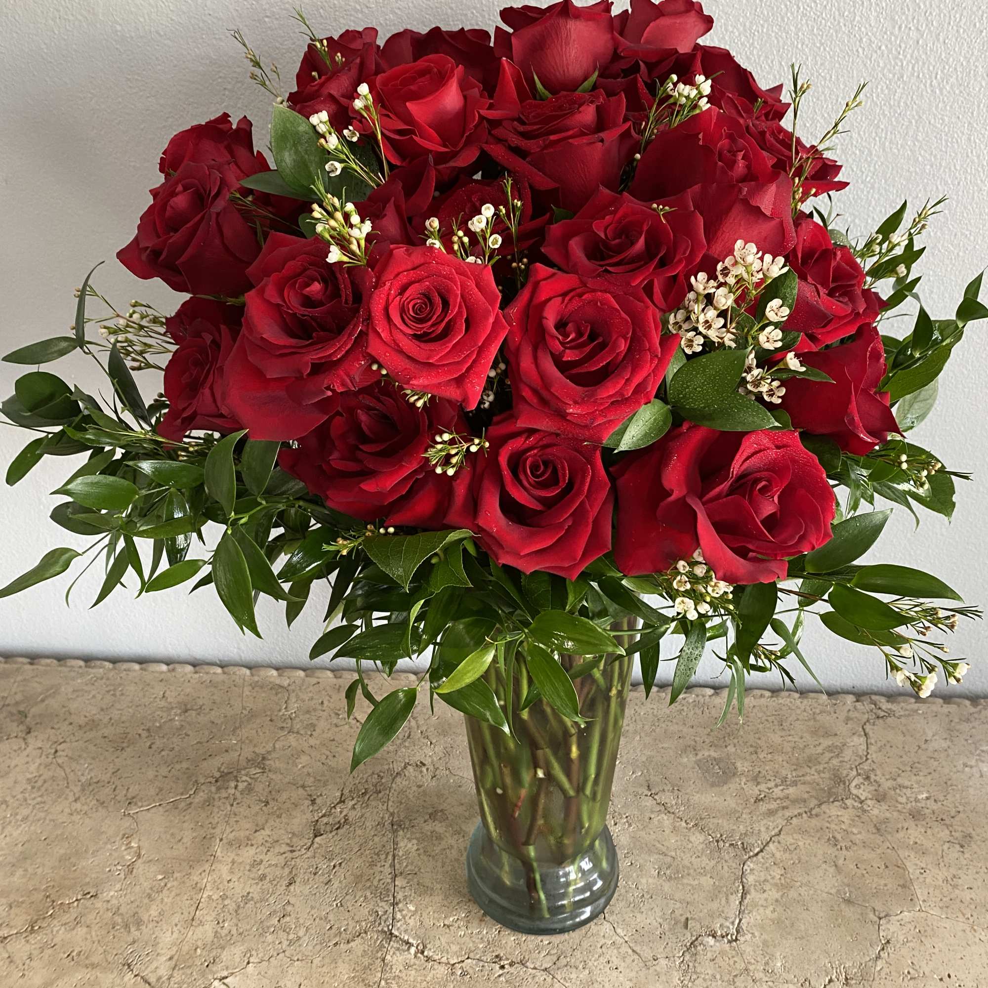 Bouquet of red roses in a clear glass vase