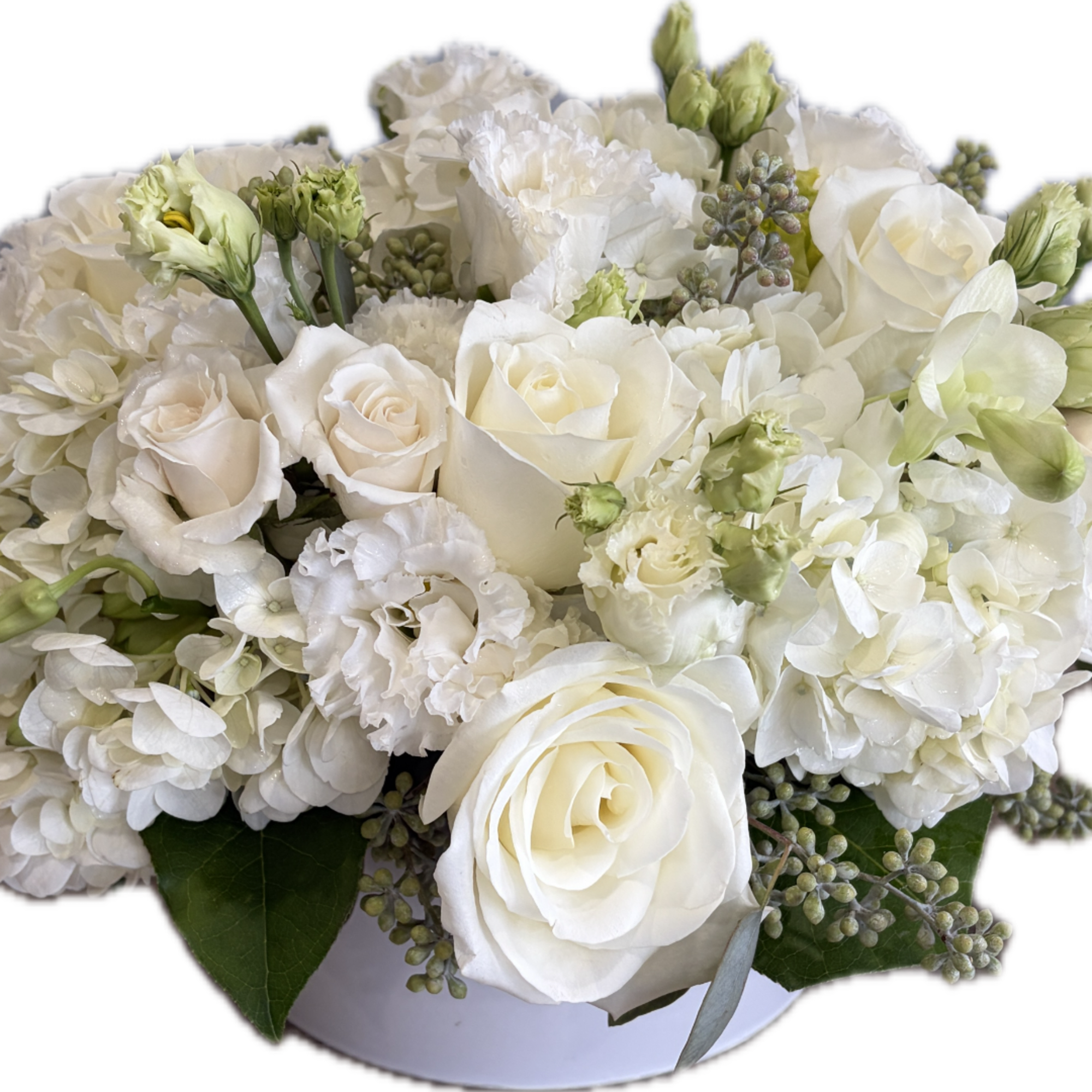 White roses and hydrangeas arranged in a low bouquet