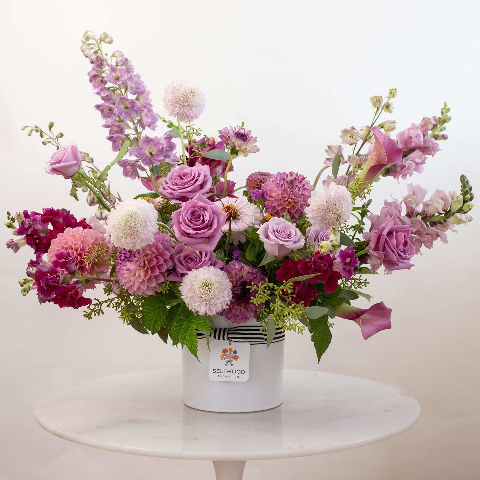 Inspired by the colors of dusk, this arrangement captures the quiet beauty