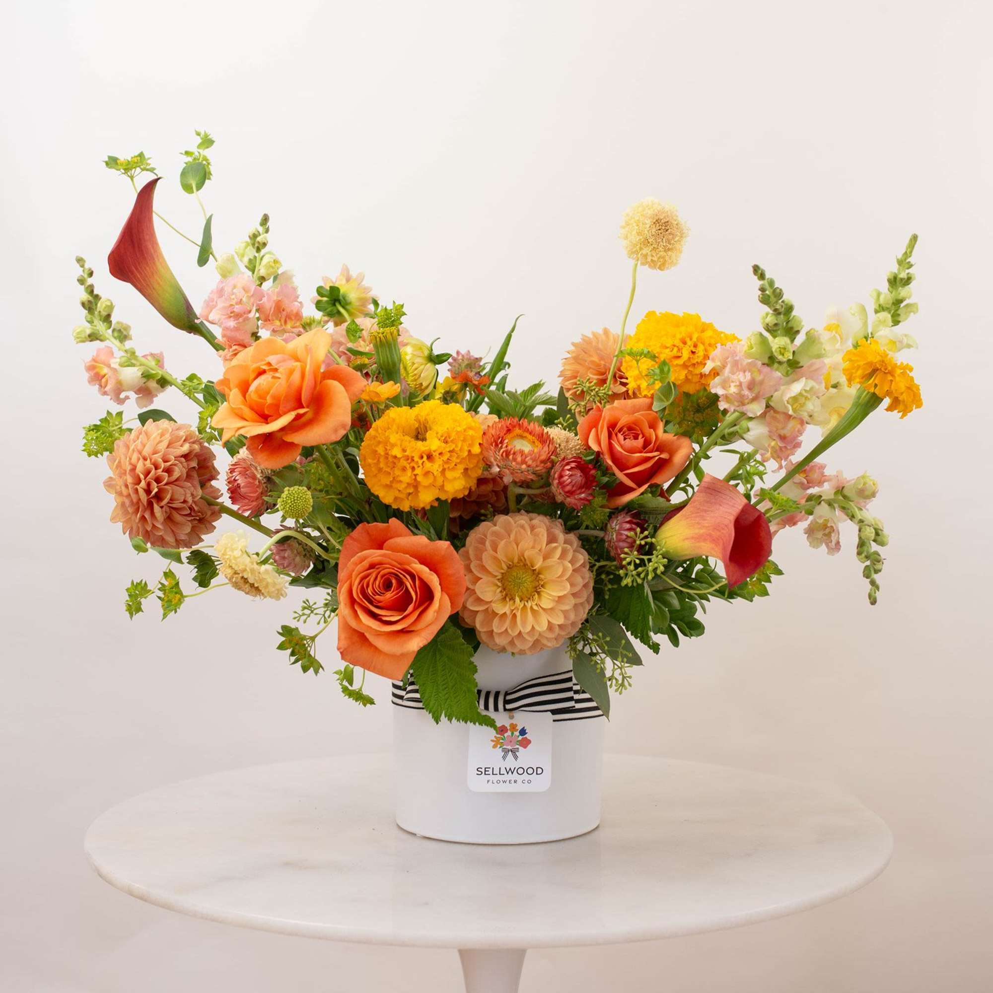 Inspired by the colors of a perfect summer sunset, this arrangement captures