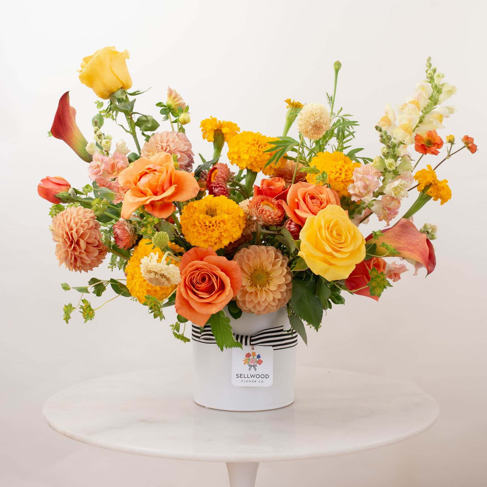 Inspired by the colors of a perfect summer sunset, this arrangement captures