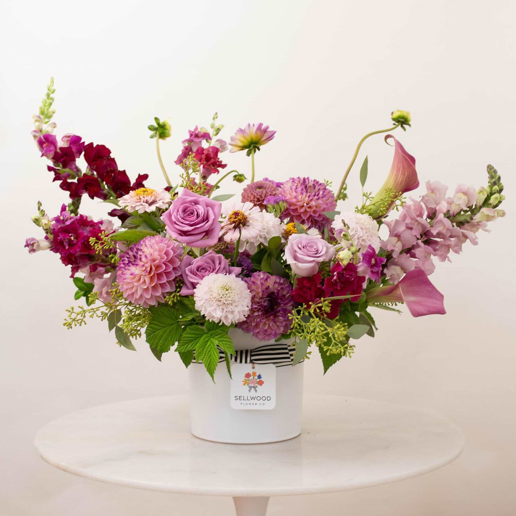 Inspired by the colors of dusk, this arrangement captures the quiet beauty