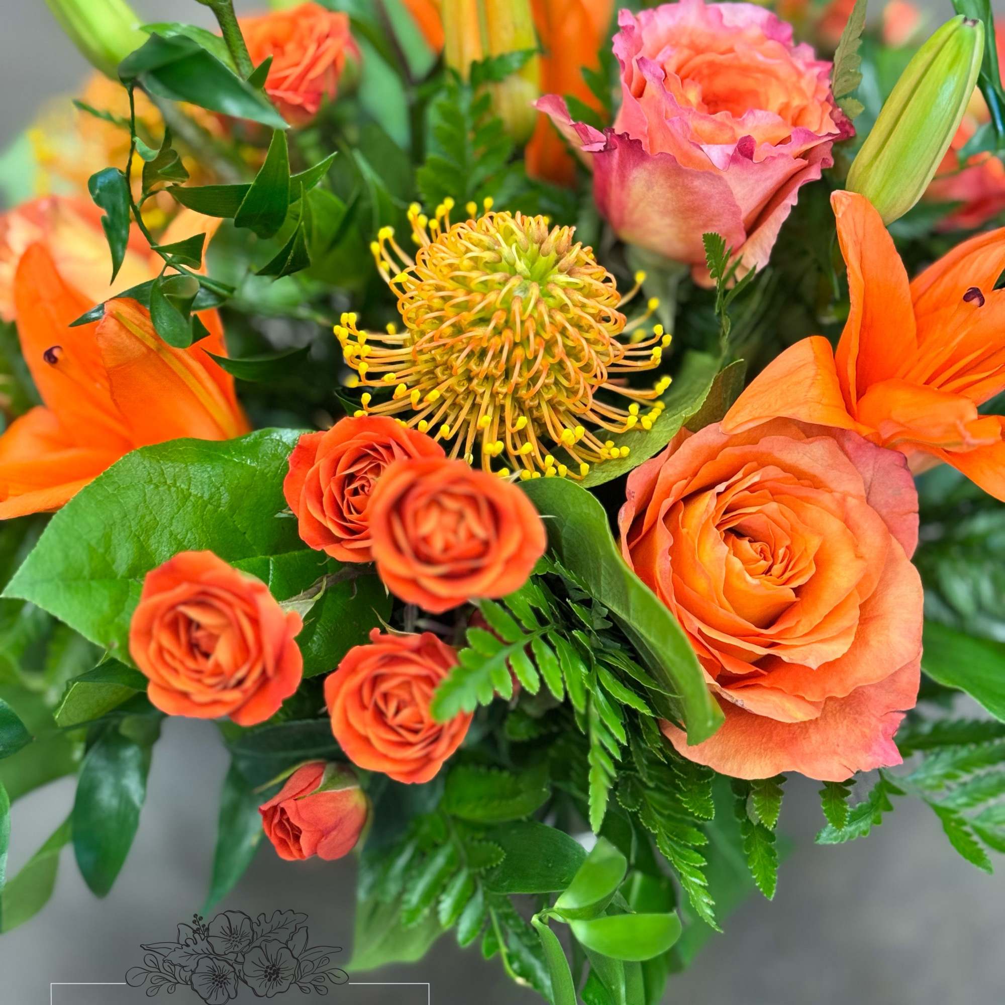 A monochromatic mix of oranges that includes pin-cushion protea, free spirit roses, photo 3 of 5