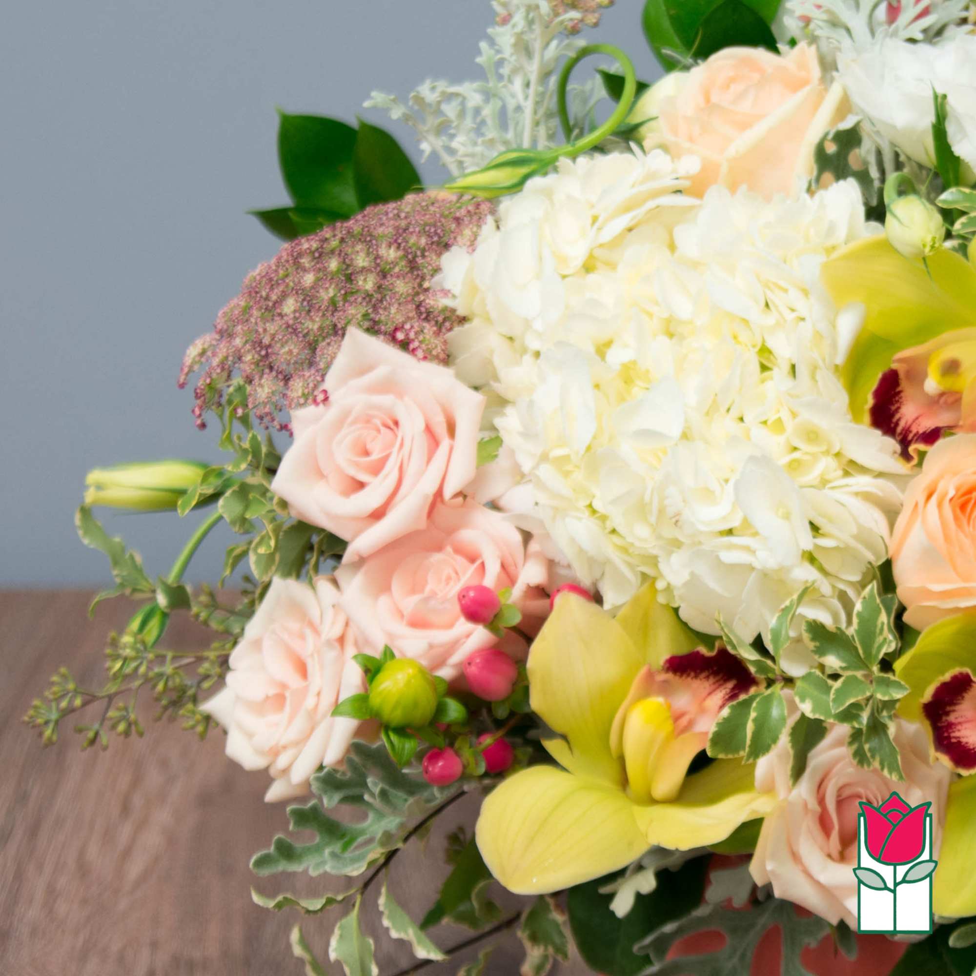 Bouquet of pale pink roses, white hydrangeas, and yellow calla lilies