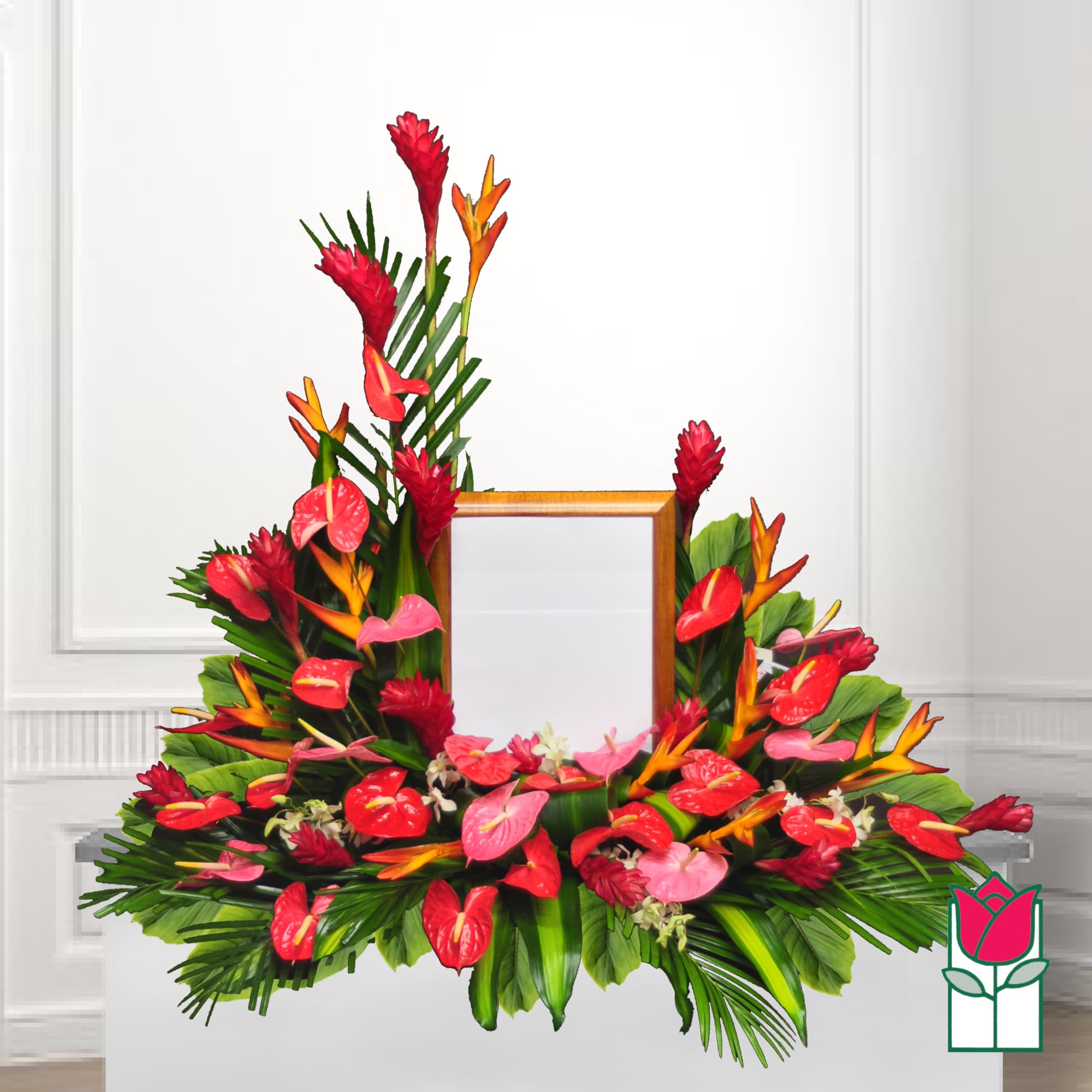 Tropical floral arrangement with red anthuriums and orange bird-of-paradise around a frame