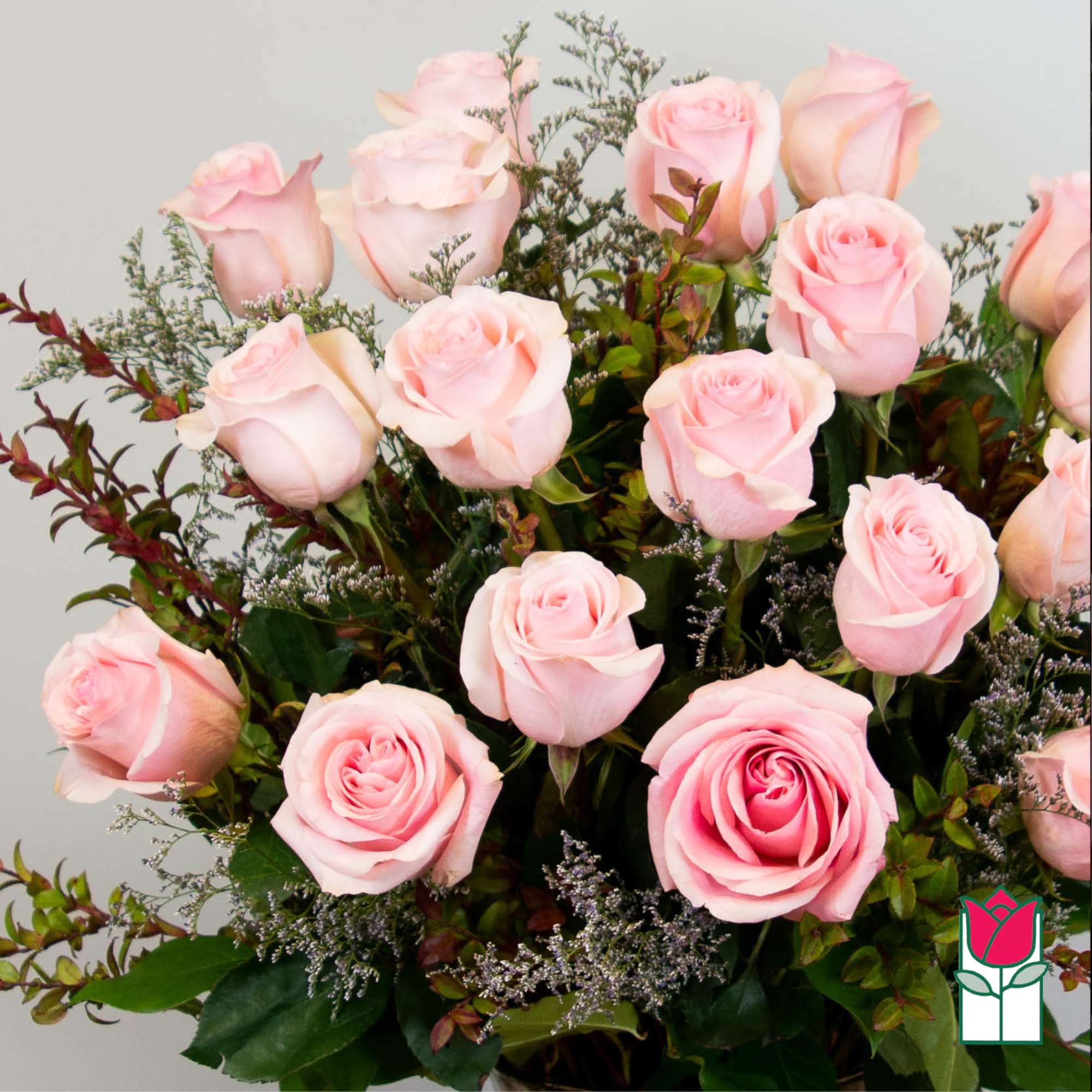 Bouquet of pale pink roses with mixed greenery