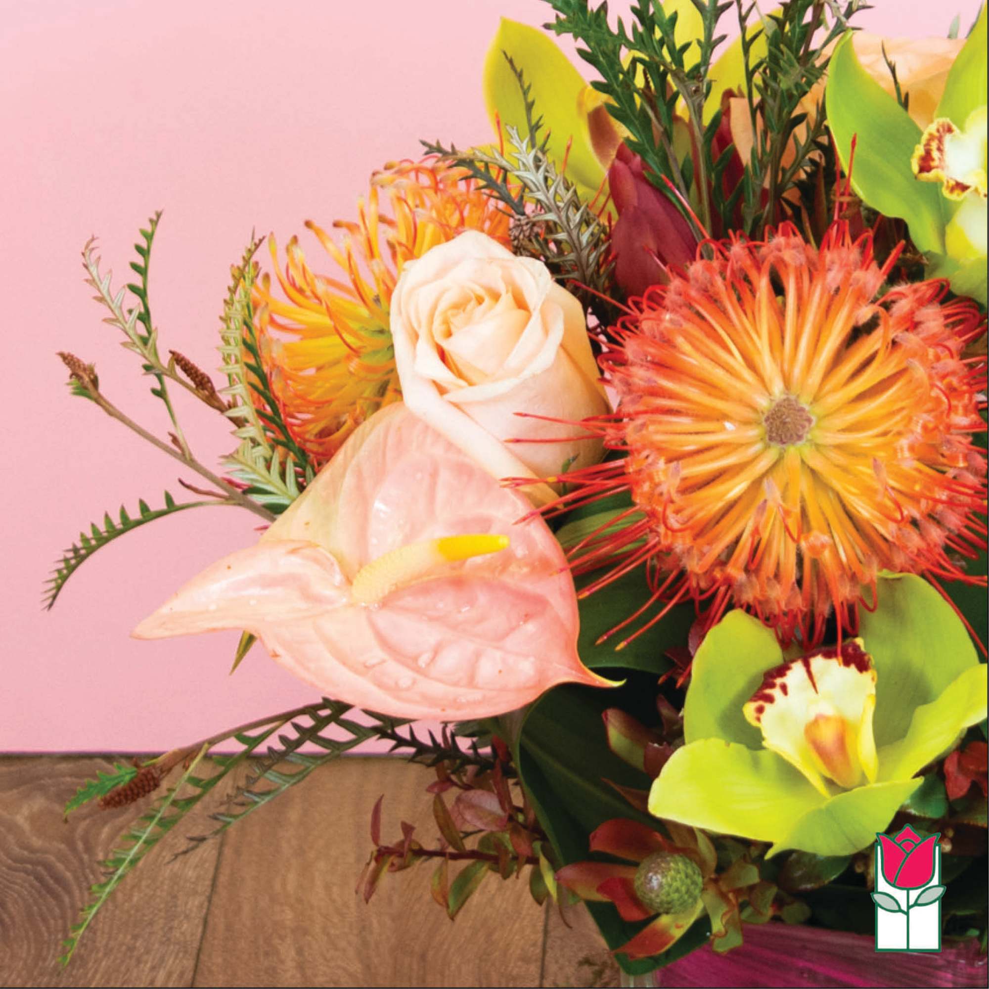 Bouquet with peach rose, pink anthurium, and orange spiky blooms