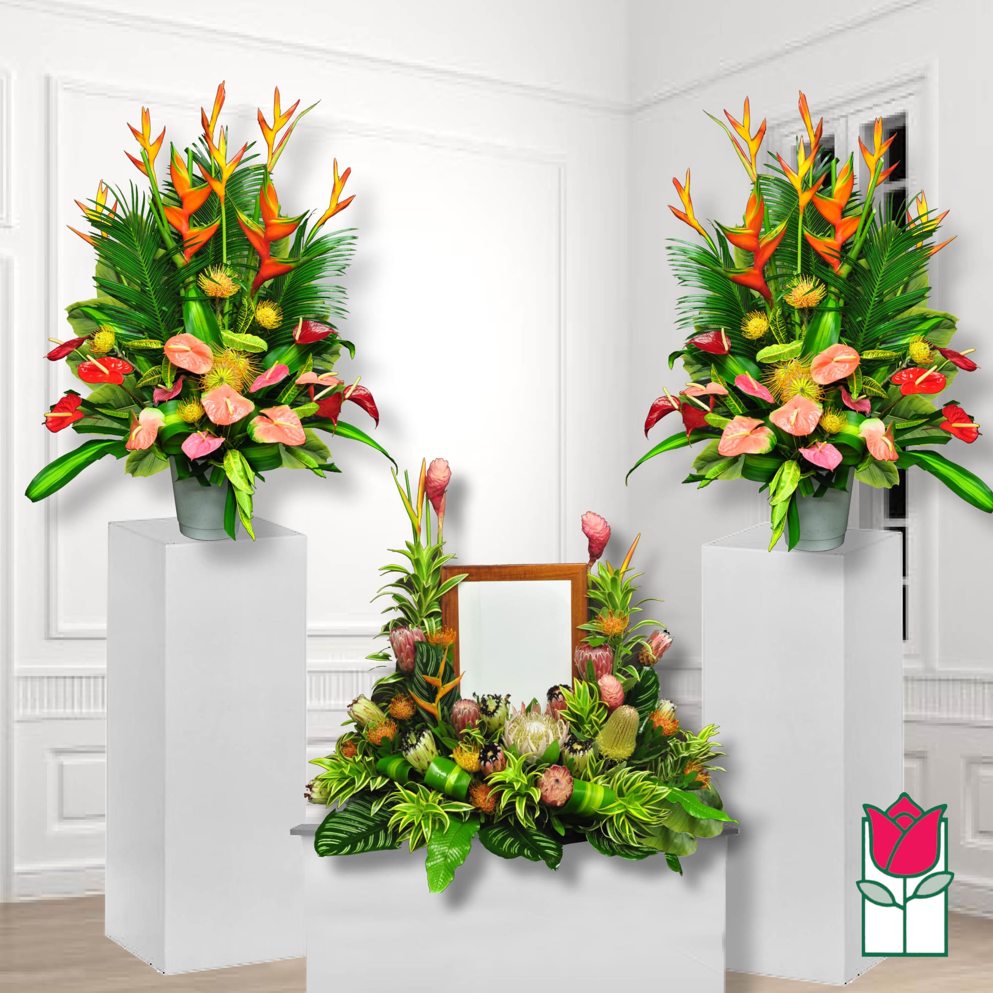 Tropical floral arrangement with orange heliconia and pink anthuriums in a vase
