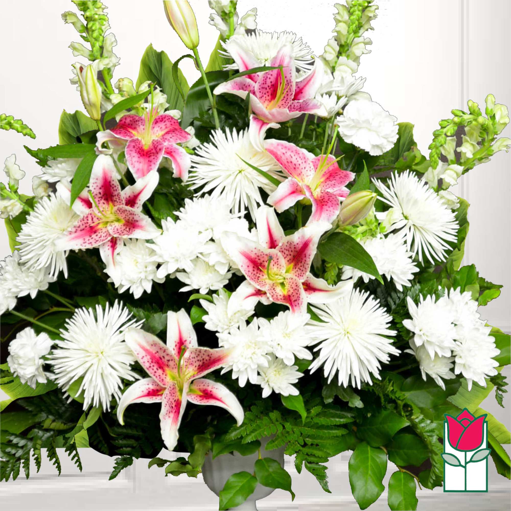 White and pink lilies with white chrysanthemums in a vase