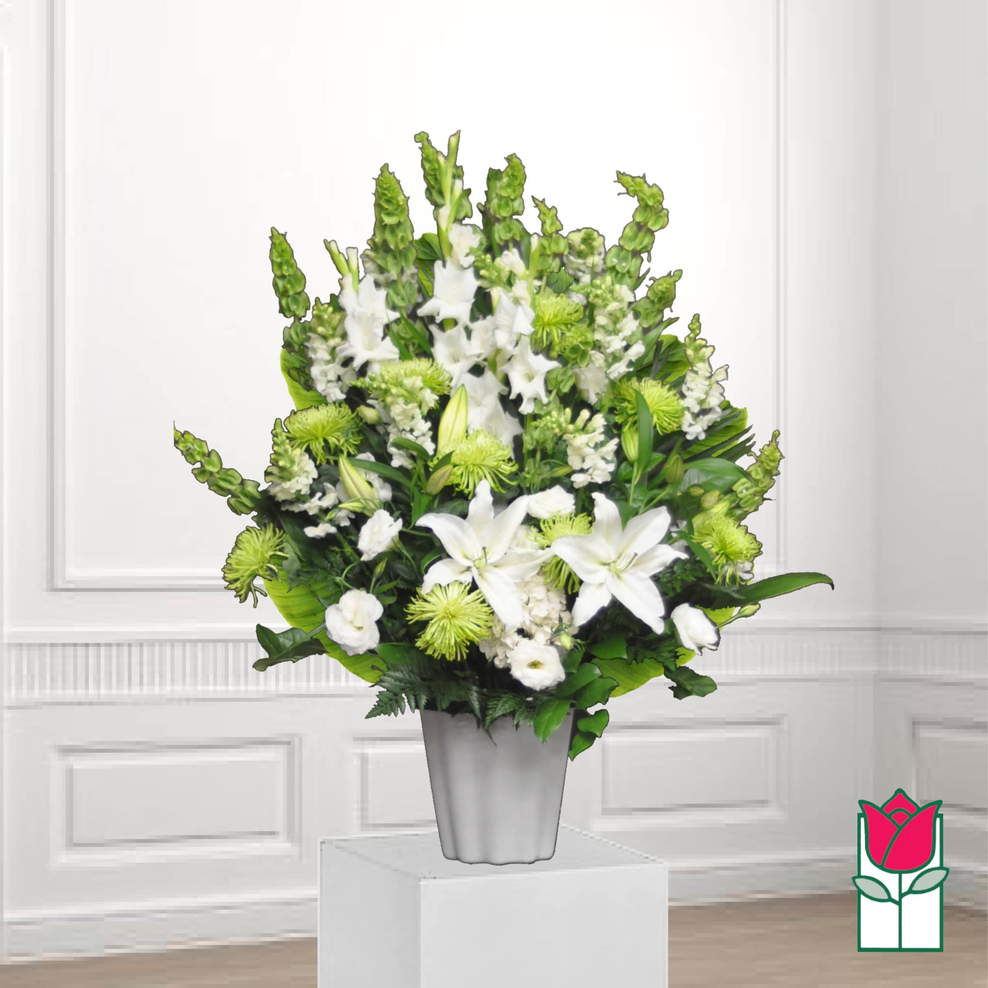 White lilies and green chrysanthemums in a silver vase