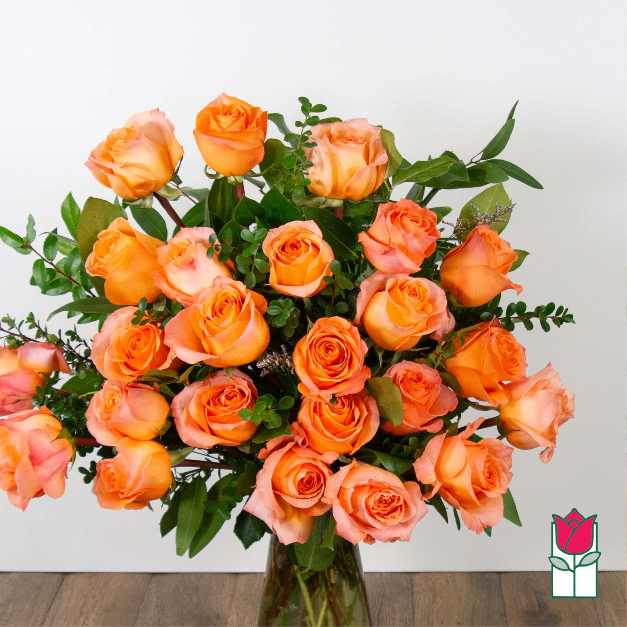 Bouquet of orange roses in a glass vase