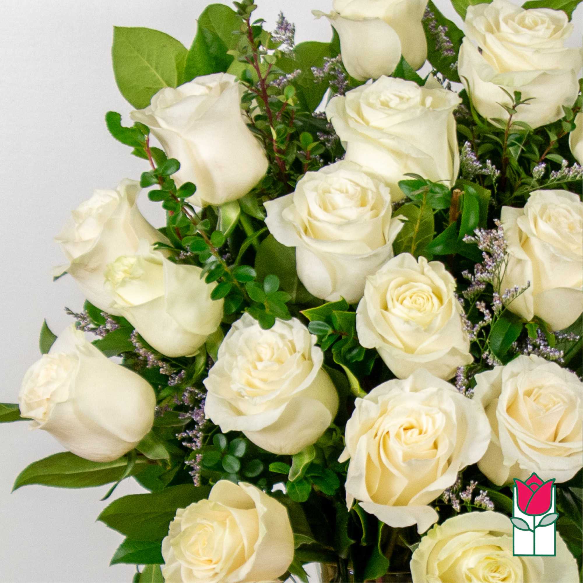 Bouquet of cream white roses with green foliage