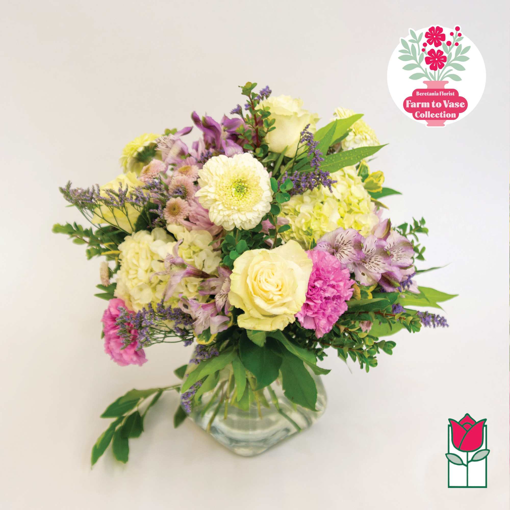 Mixed pastel bouquet in a clear glass vase