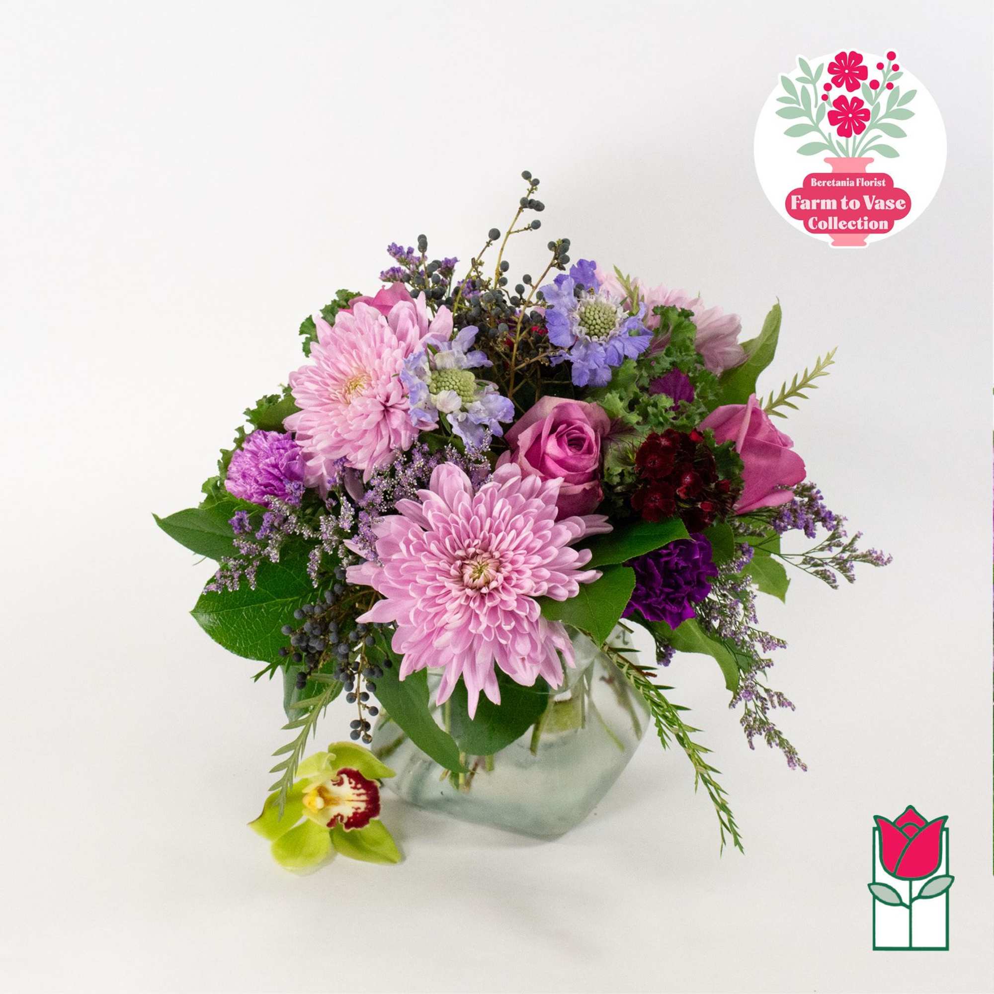 Pink and purple mixed bouquet in a clear glass vase
