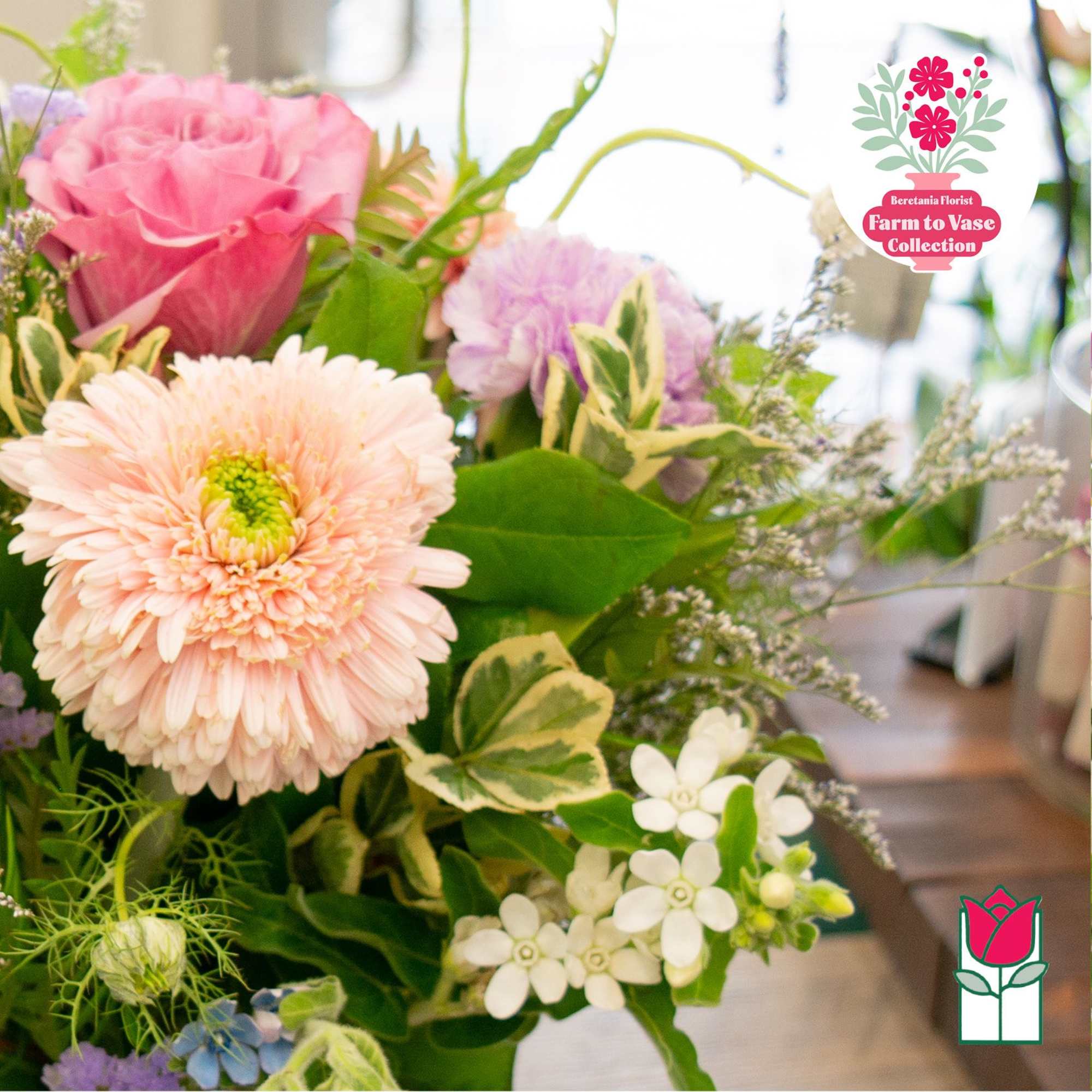 Pink and peach mixed bouquet with a large gerbera daisy and roses