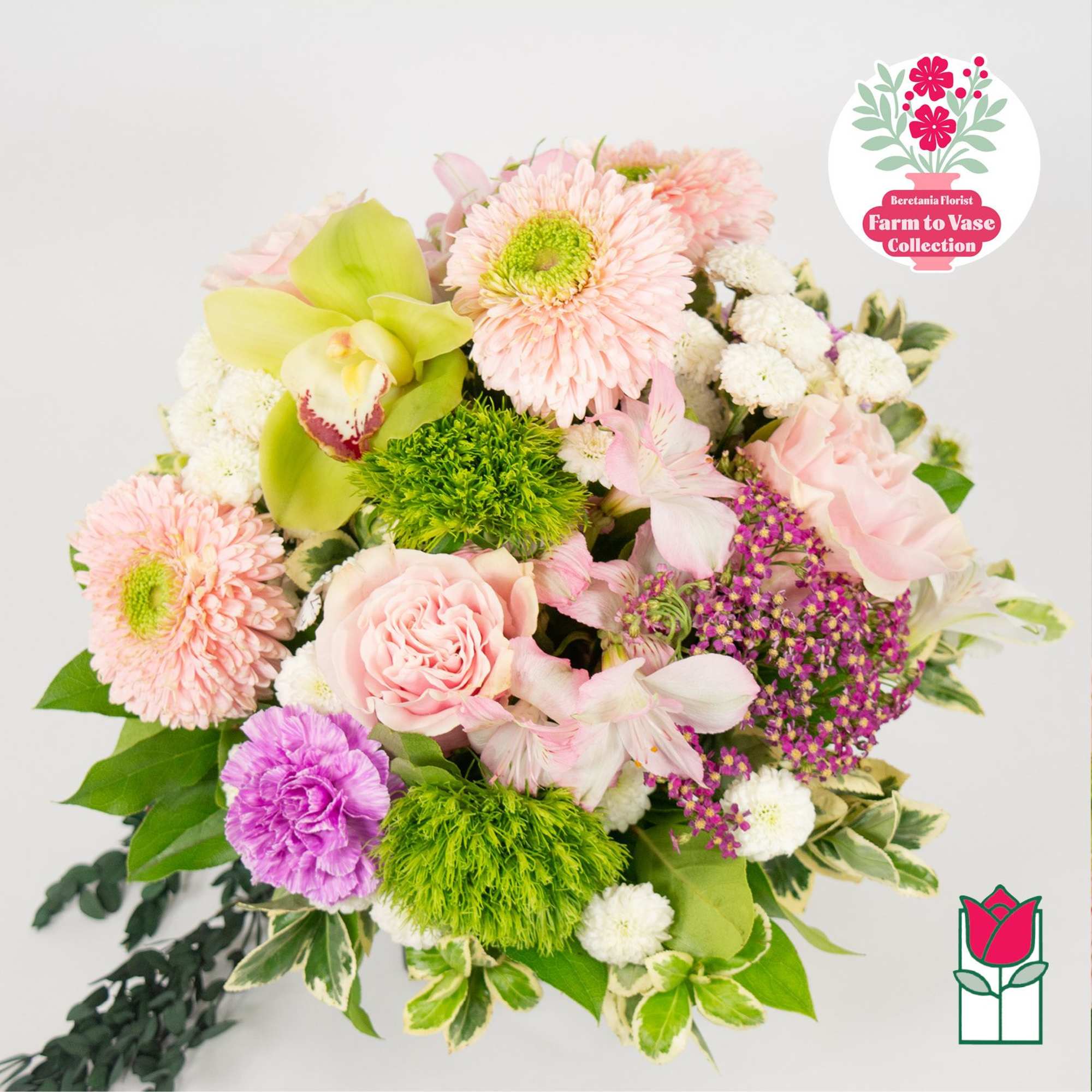 Mixed bouquet with pink flowers, green orchids, and purple accents