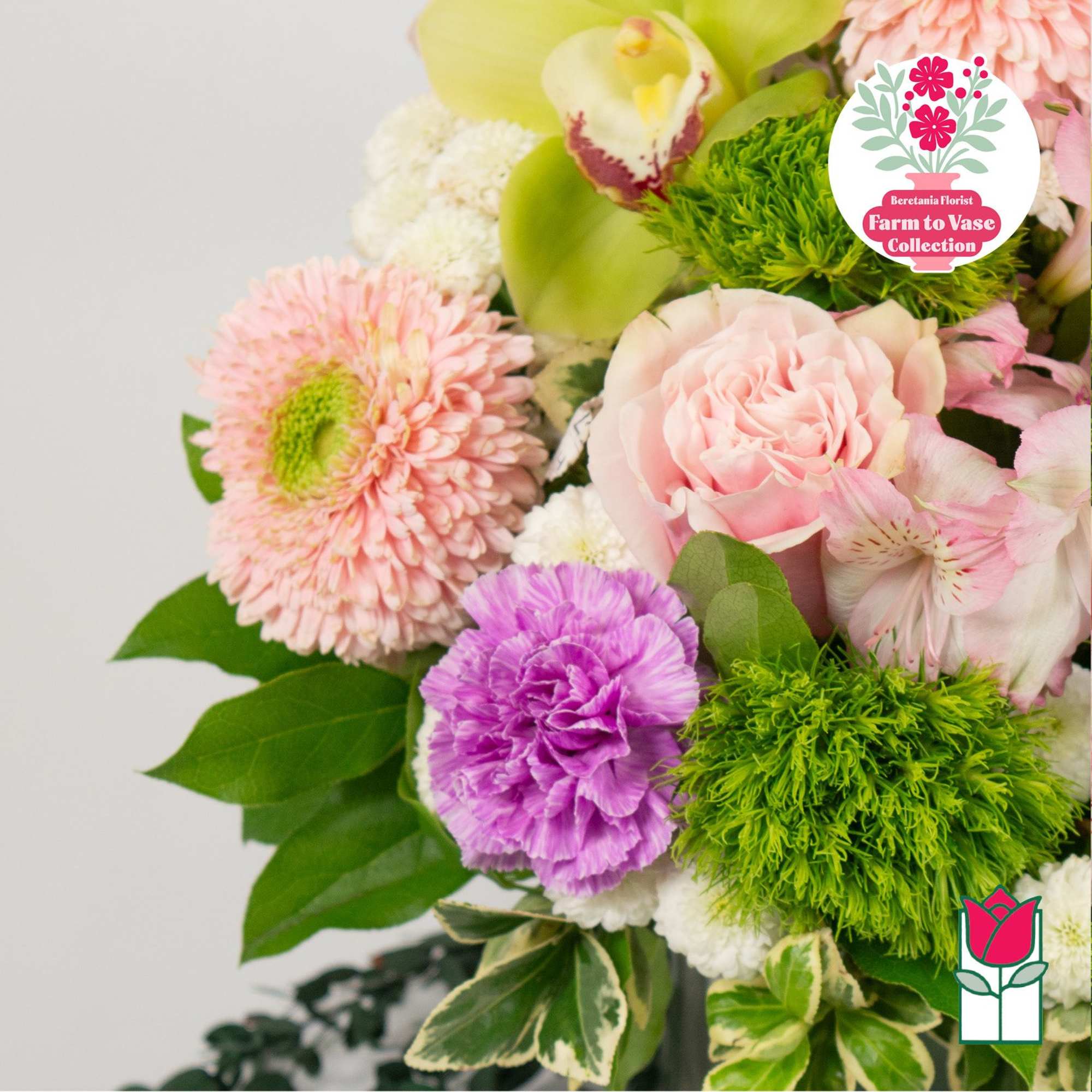 Bouquet of pink and purple flowers with bright green accents
